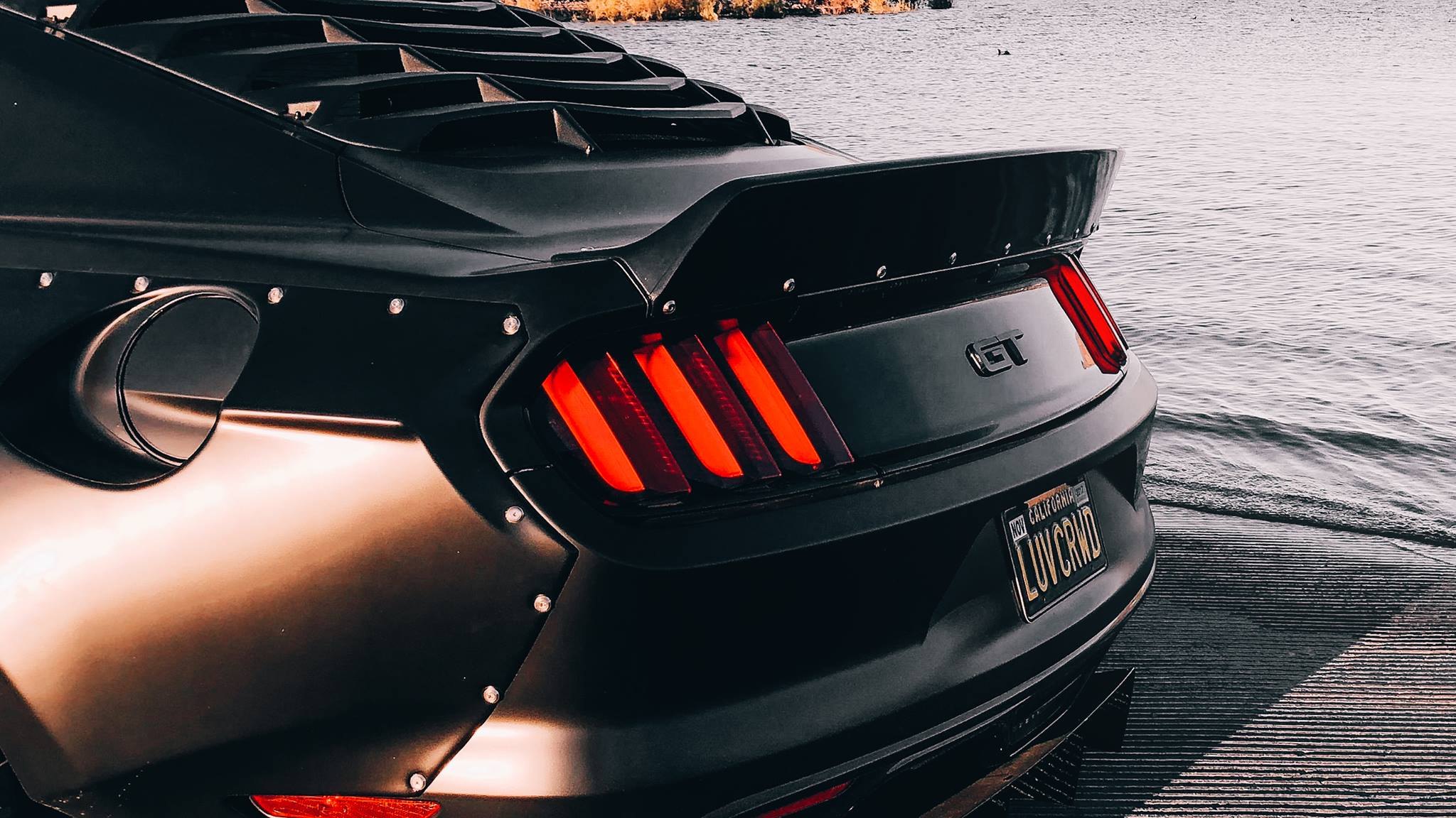 Aftermarket Rear Spoiler on Black Ford Mustang GT - Photo by Clinched