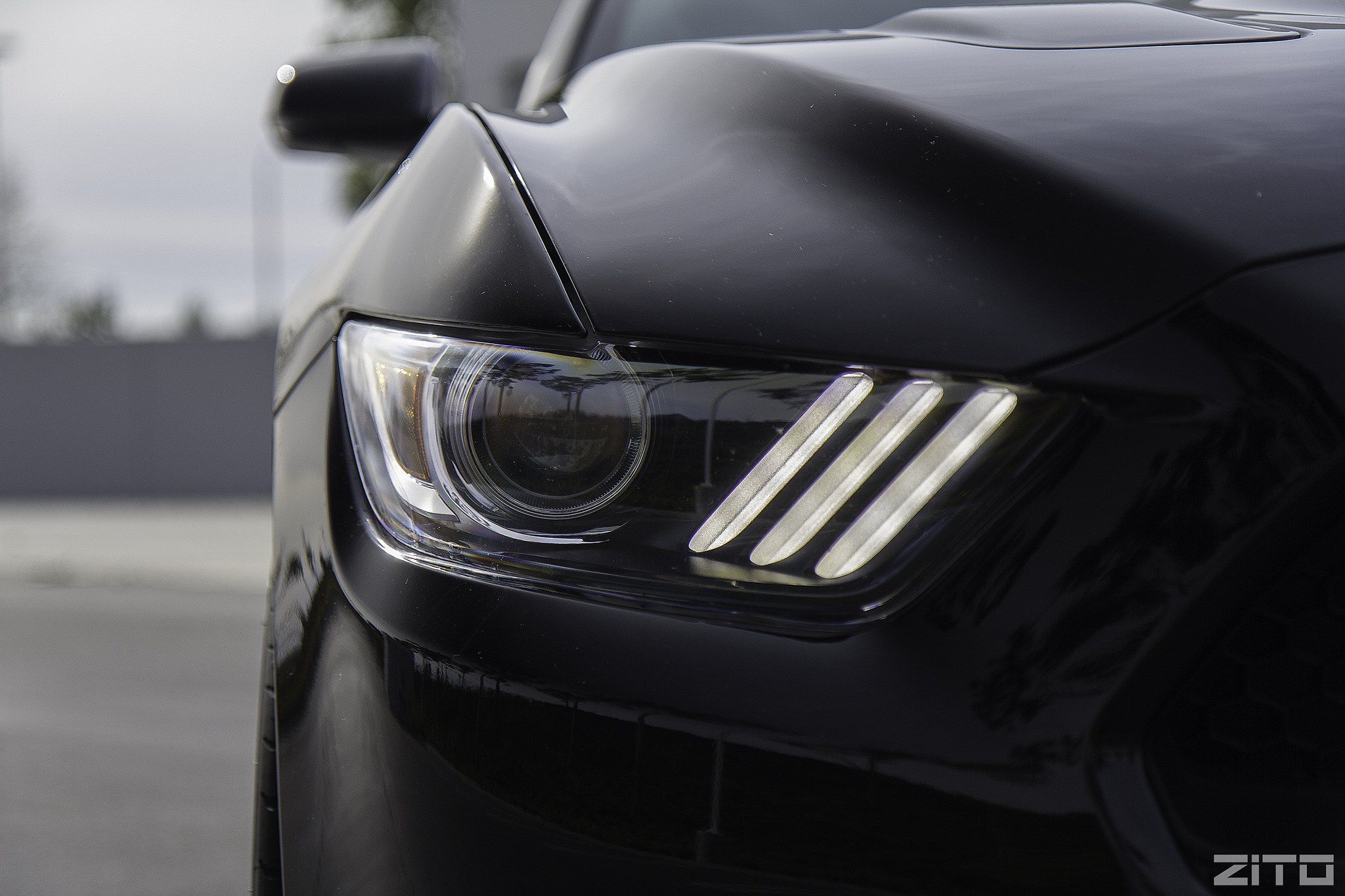 Black Ford Mustang with Custom Dark Smoke Headlights - Photo by Zito Wheels