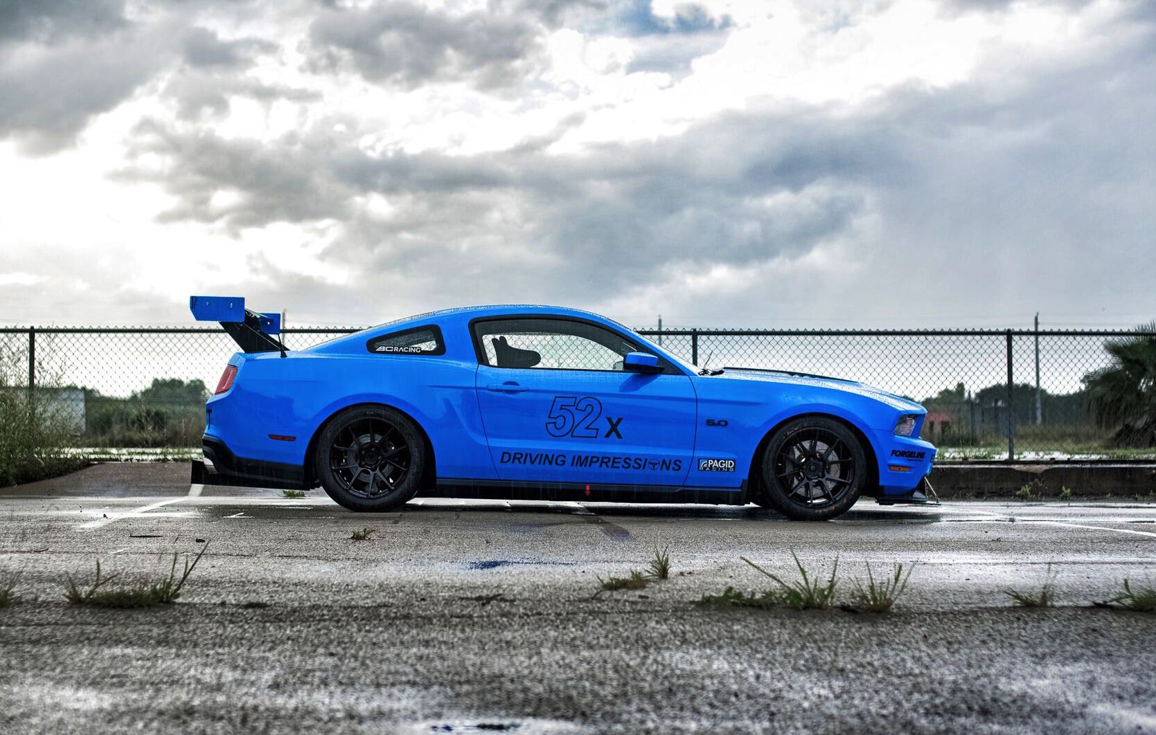 Blue Debadged Ford Mustang with Aftermarket Side Skirts - Photo by Forgeline Motorsports