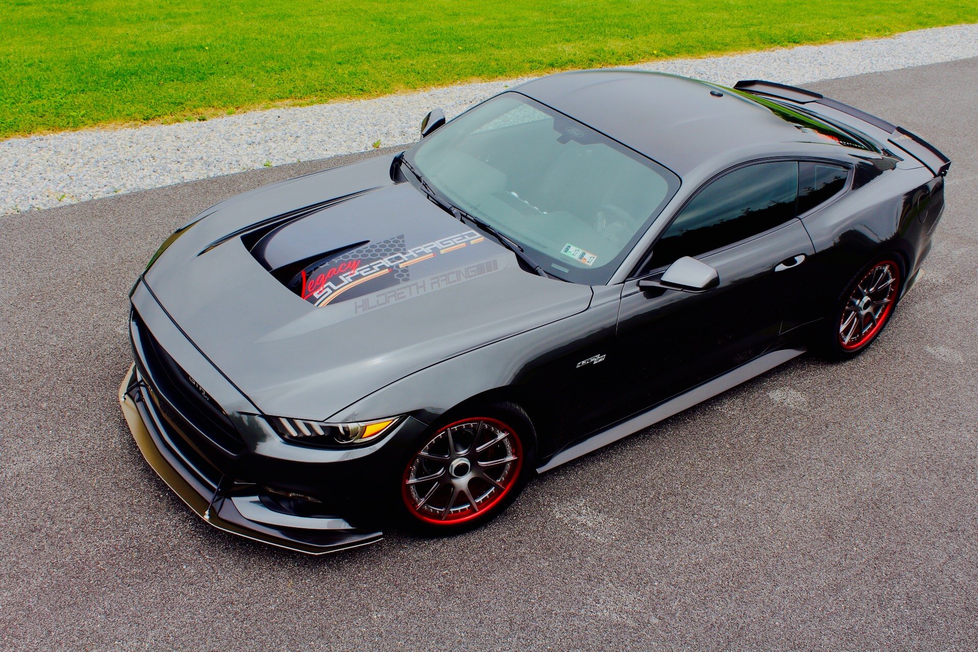 Black Supercharged Ford Mustang with Aftermarket Hood - Photo by Forgeline Motorsports