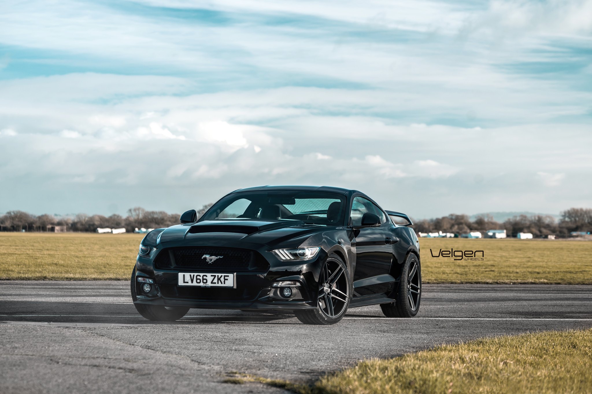 Front Bumper with Fog Lights on Black Ford Mustang - Photo by Velgen