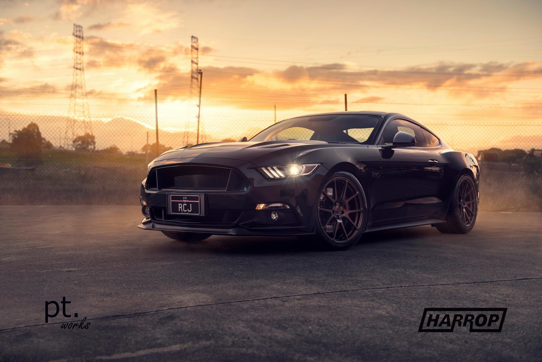 Black Ford Mustang 5.0 with Aftermarket Headlights - Photo by PT works