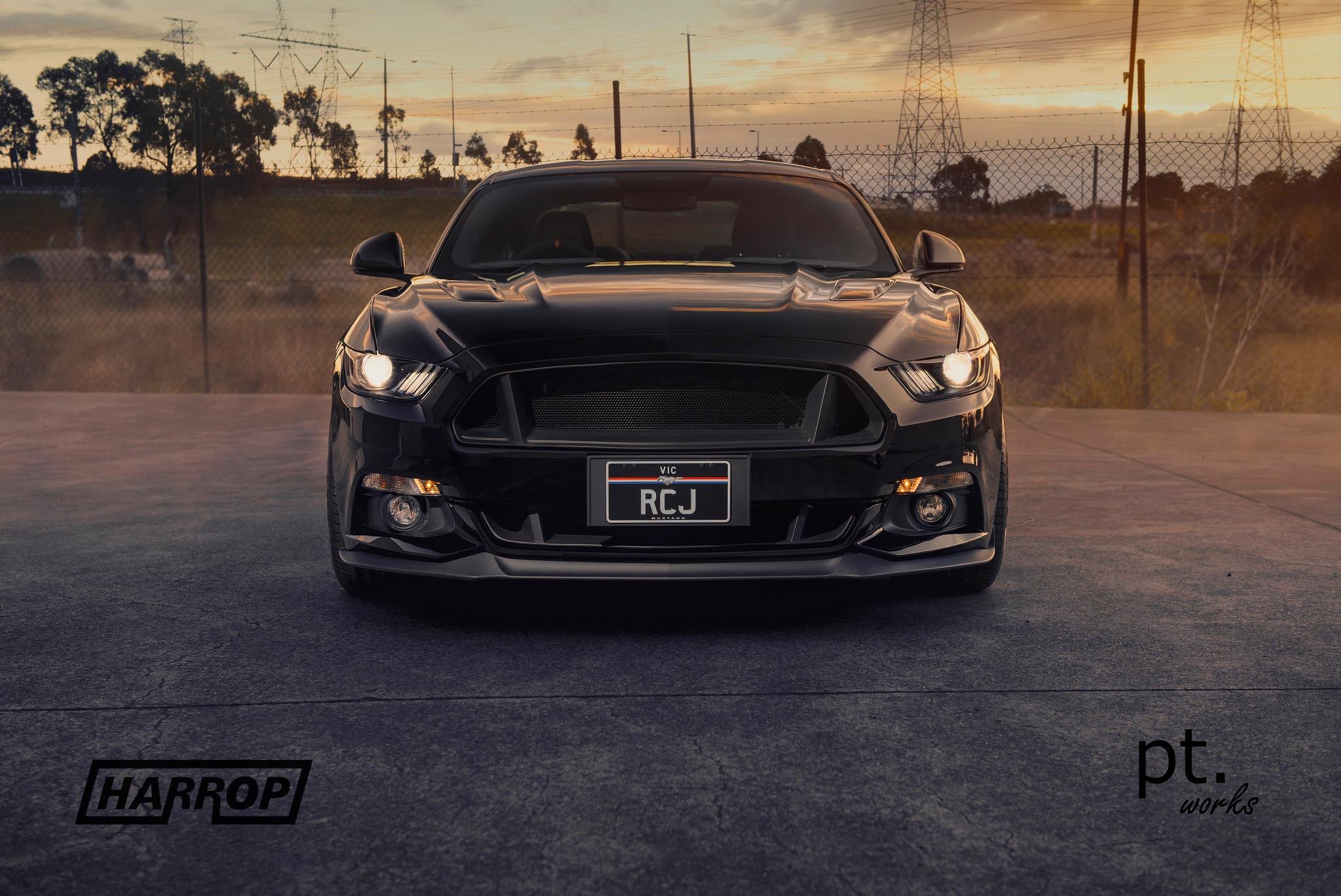 Front Bumper with Fog Lights on Black Ford Mustang - Photo by PT works