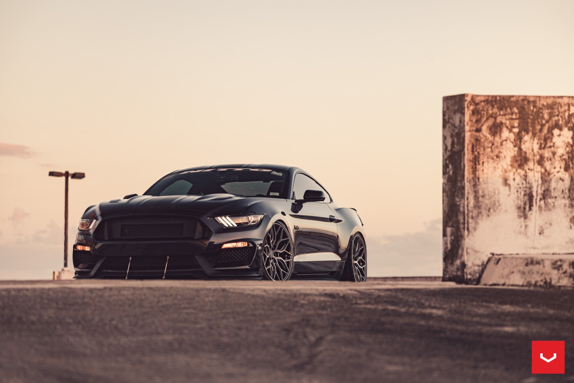 Aftermarket Projector Headlights on Black Ford Mustang - Photo by Vossen