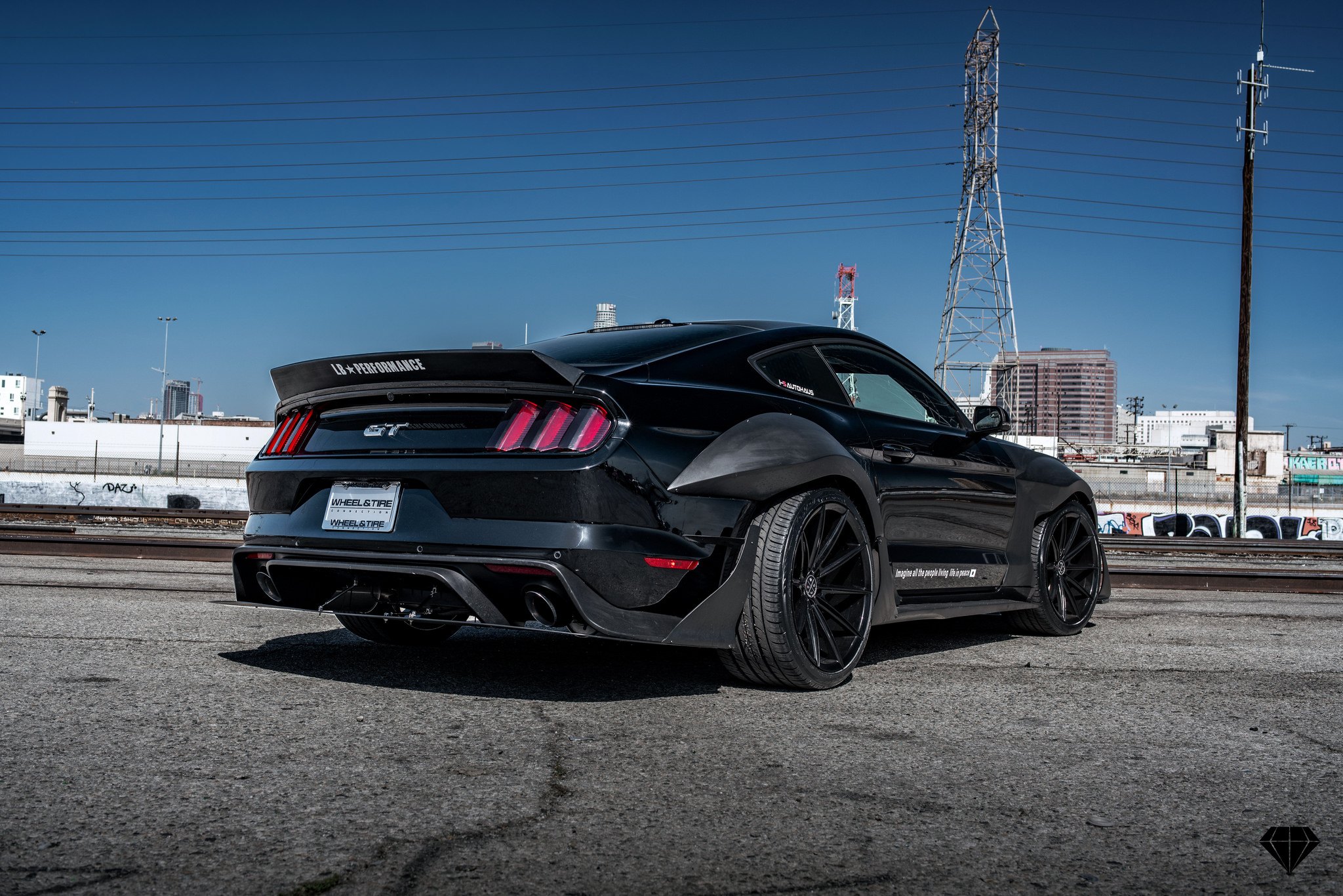 Carbon Fiber Rear Diffuser on Black Ford Mustang GT - Photo by Blaque Diamond Wheels