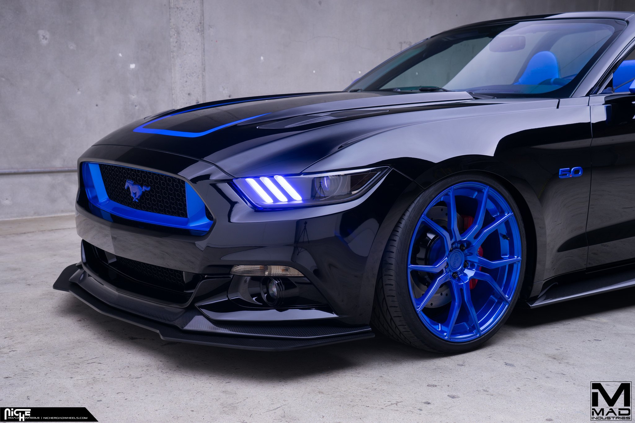 Blue LED headlights on Ford Mustang GT - Photo by MAD Industries