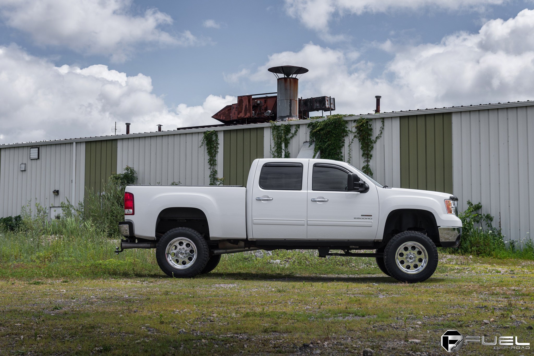 White GMC Sierra with Retractable Running Boards - Photo by Fuel Offroad