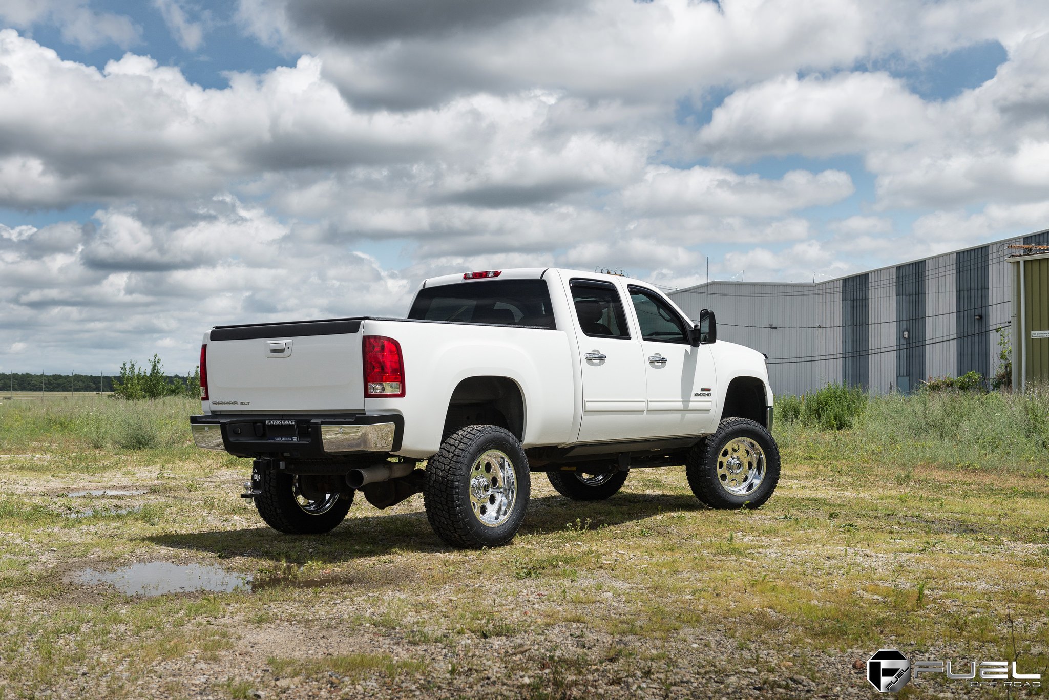 White Lifted GMC Sierra with Custom Fuel Offroad Rims - Photo by Fuel Offroad