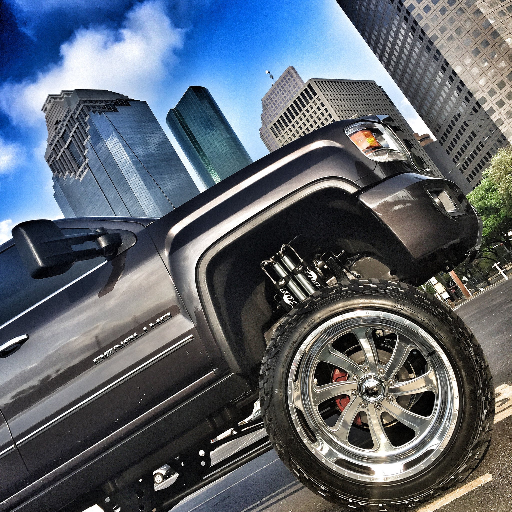 Black Lifted GMC Sierra with Polished Fuel Offroad Wheels - Photo by Fuel Offroad