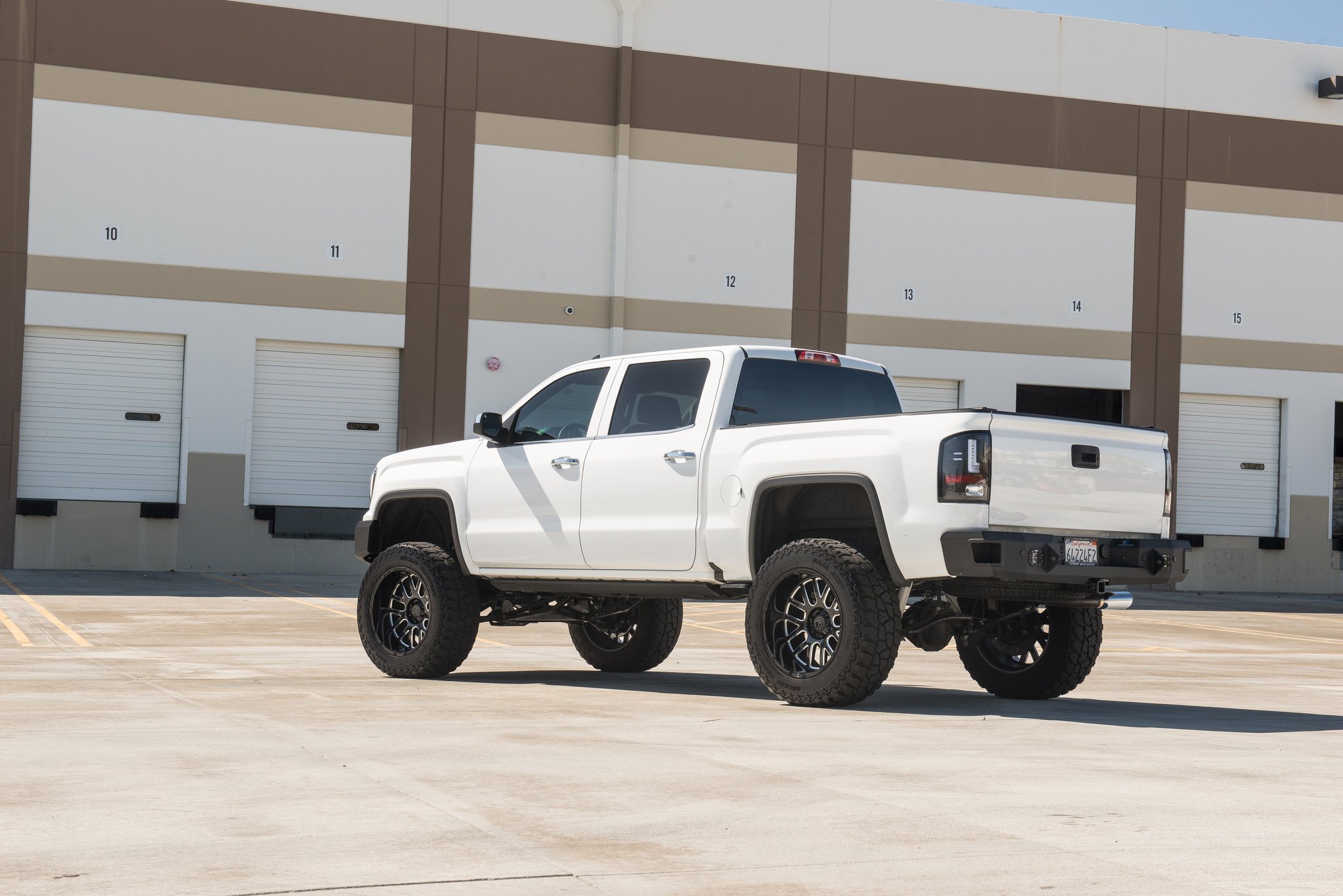 Aftermarket LED Taillights on White Lifted GMC Sierra - Photo by Black Rhino Wheels