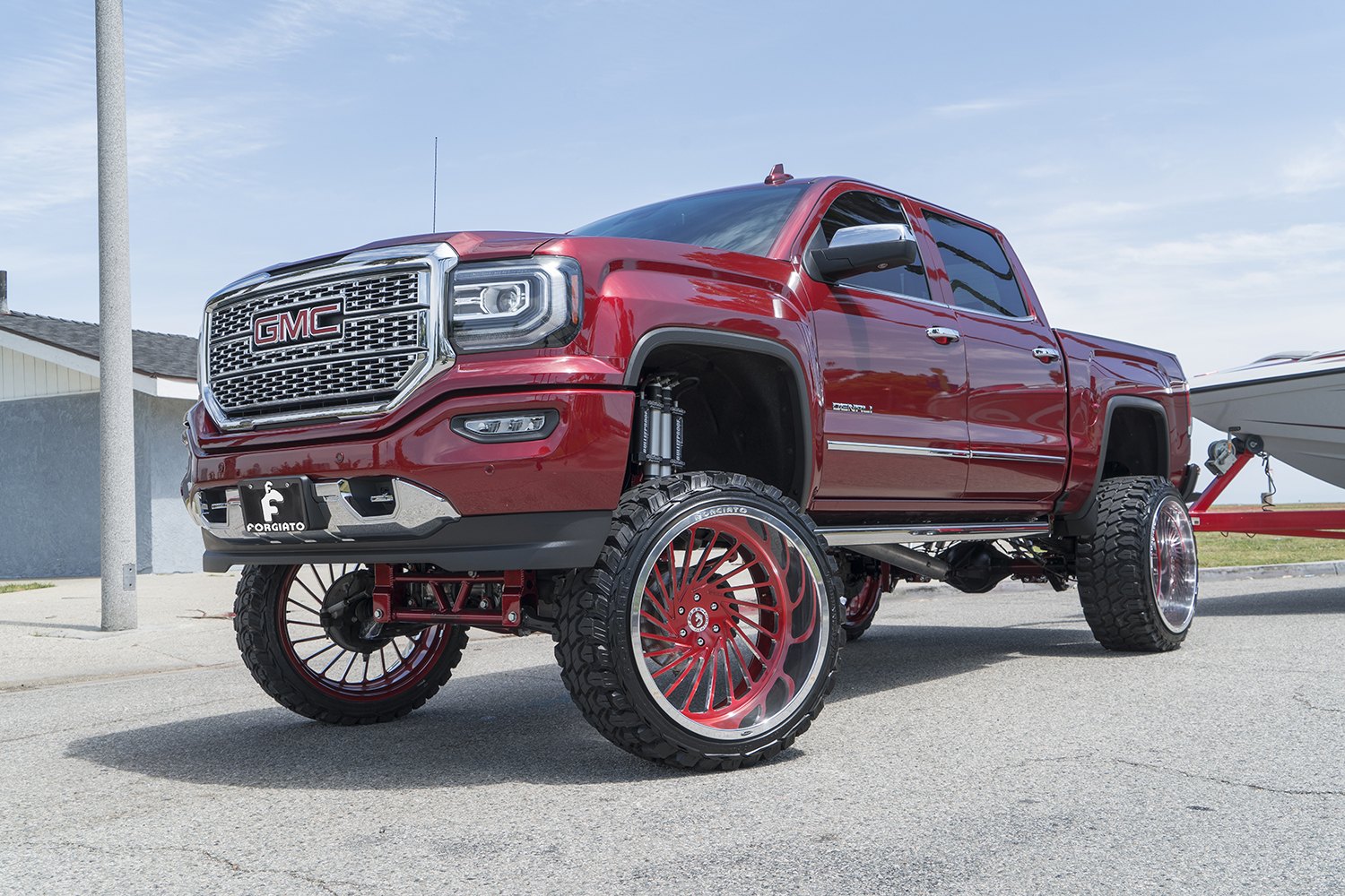 Red Lifted GMC Sierra Denali with Chrome Mesh Grille - Photo by Forgiato