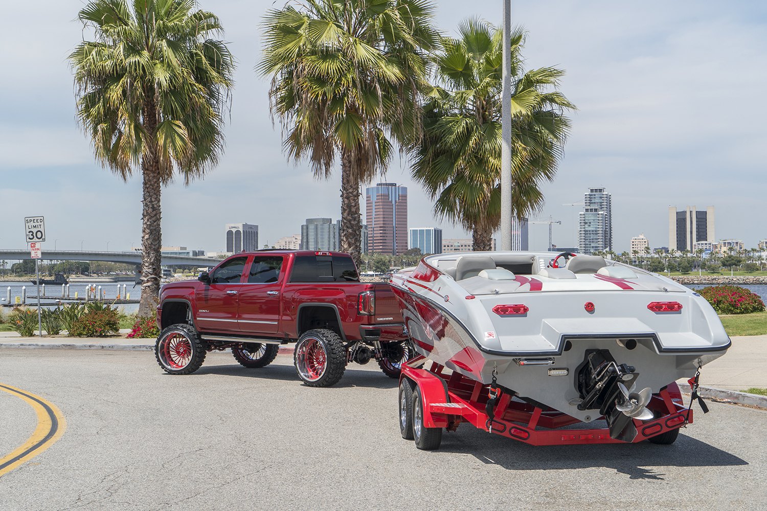 Trailer Hitch on Red Lifted GMC Sierra Denali - Photo by Forgiato