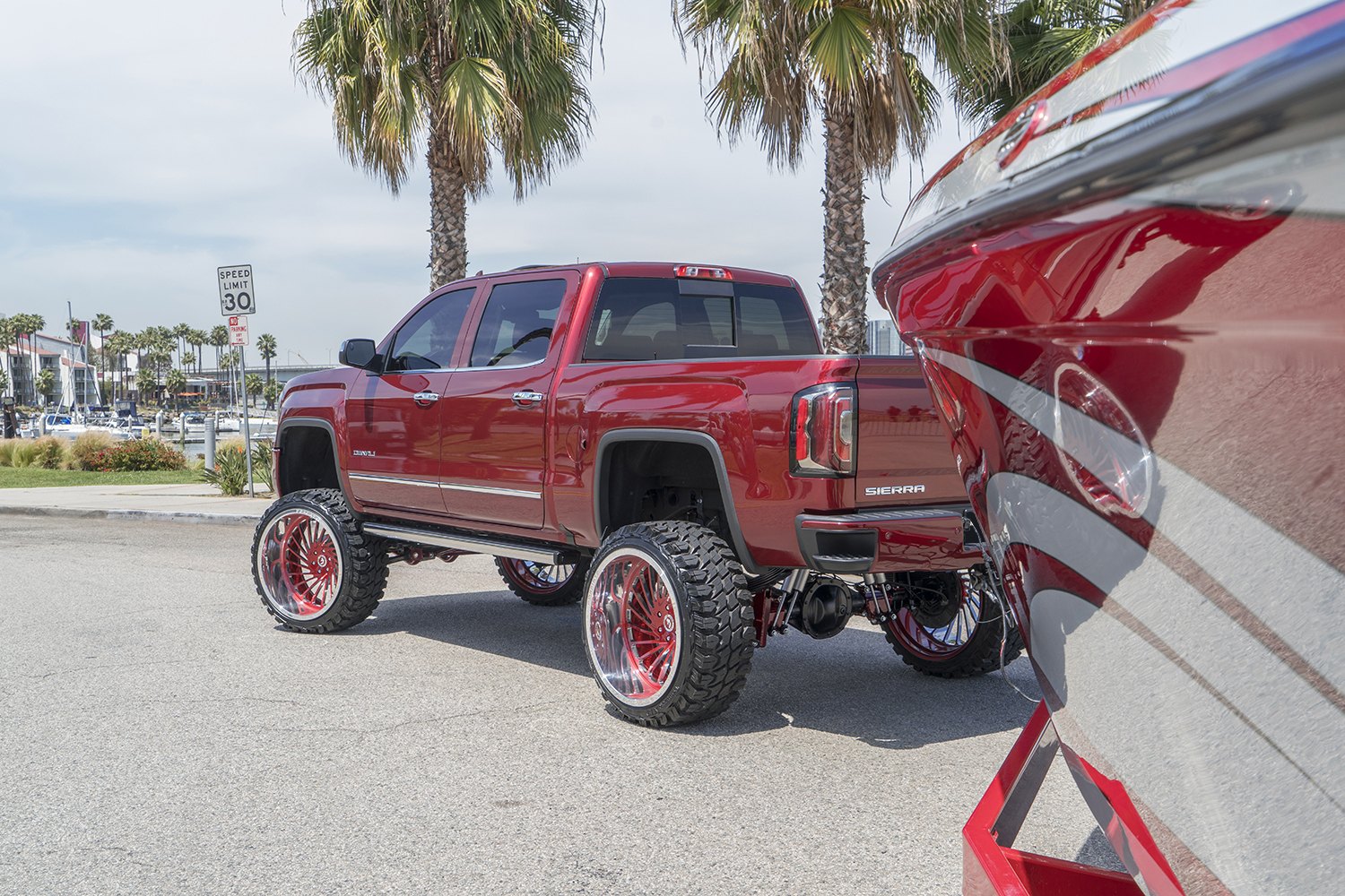 Red GMC Sierra Denali with Custom LED Taillights - Photo by Forgiato