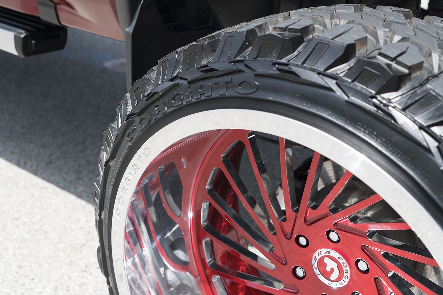 Red Lifted GMC Sierra Denali with Custom Forgiato Wheels - Photo by Forgiato