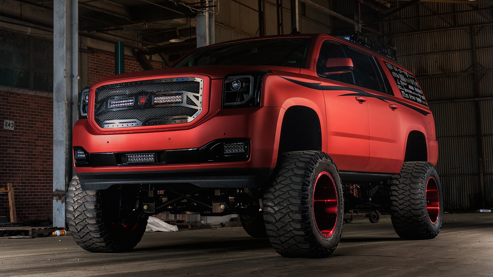 Lifted GMC Yukon With Chrome Red Vinyl Wrap - Photo by Dale Martin