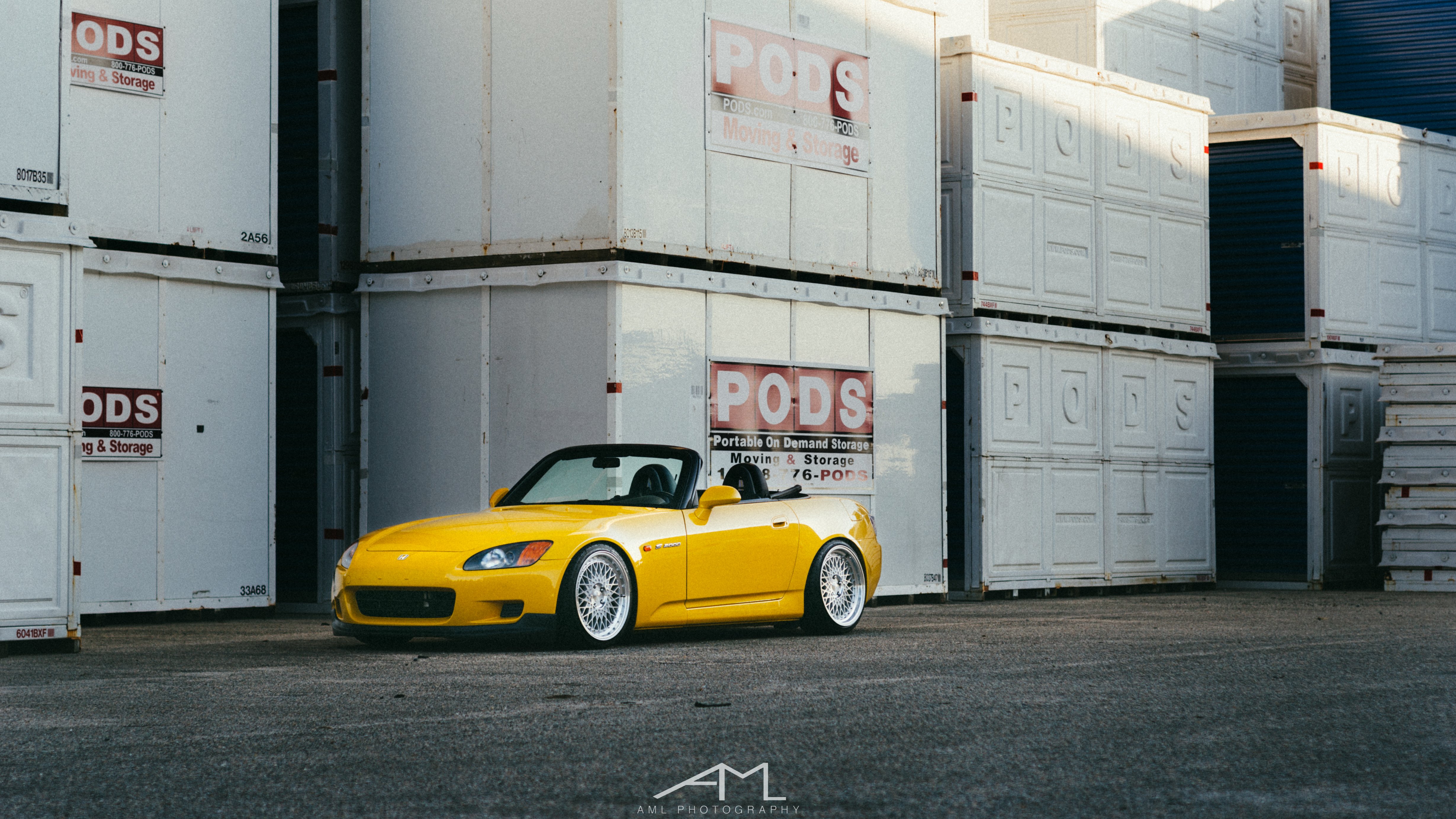 Yellow Convertible Honda S2000 with Aftermarket Headlights - Photo by Arlen Liverman
