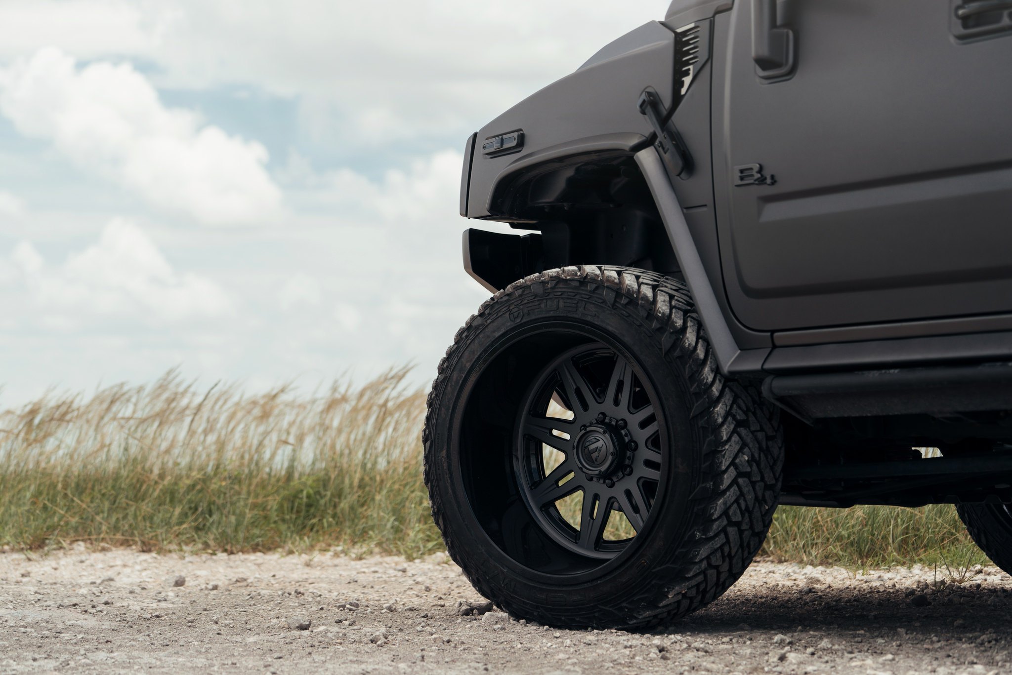 Black Matte Hummer H2 with Custom Fuel Offroad Wheels - Photo by Fuel Offroad
