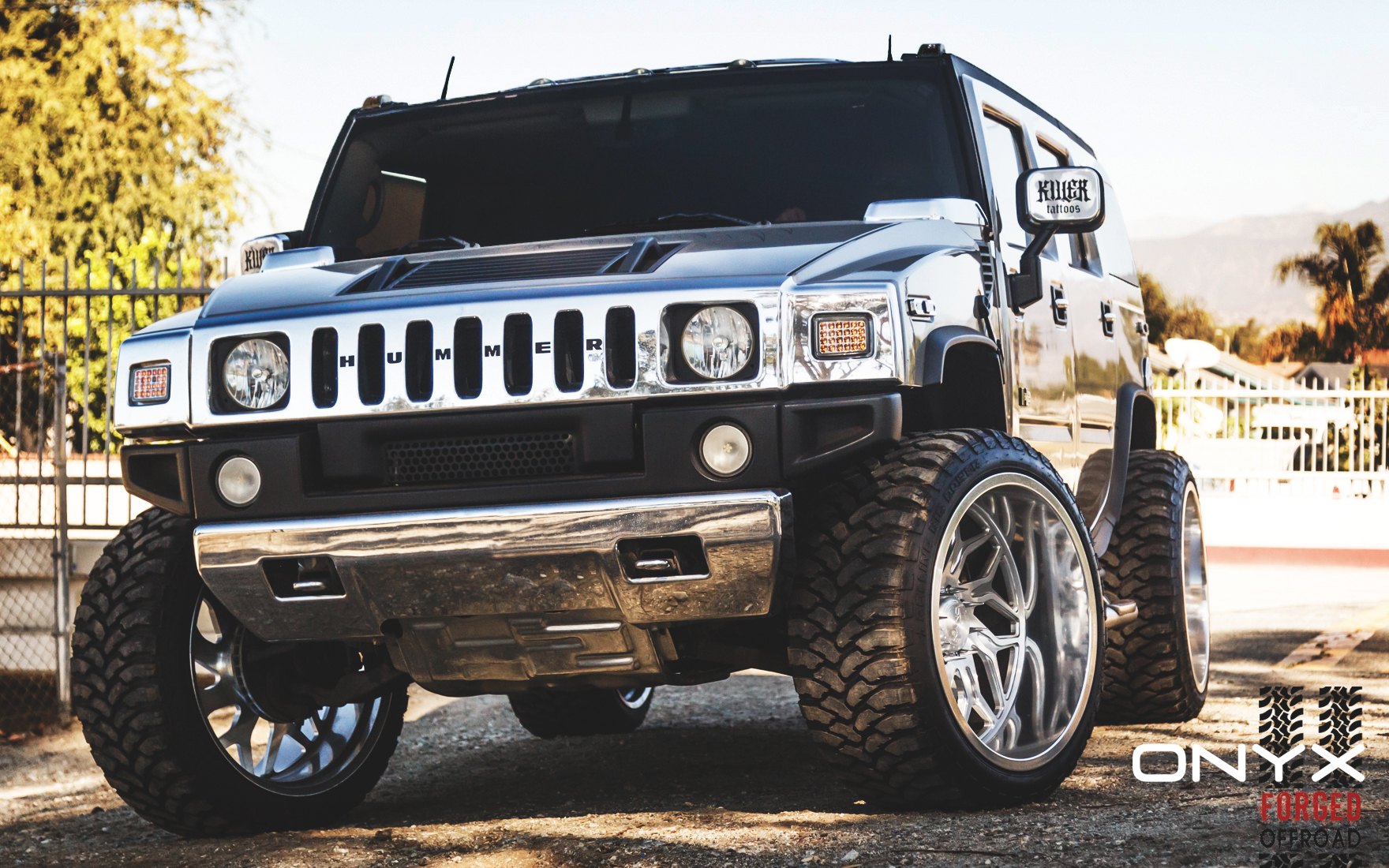 Silver Hummer H2 with Custom Front Bumper - Photo by Rennen International