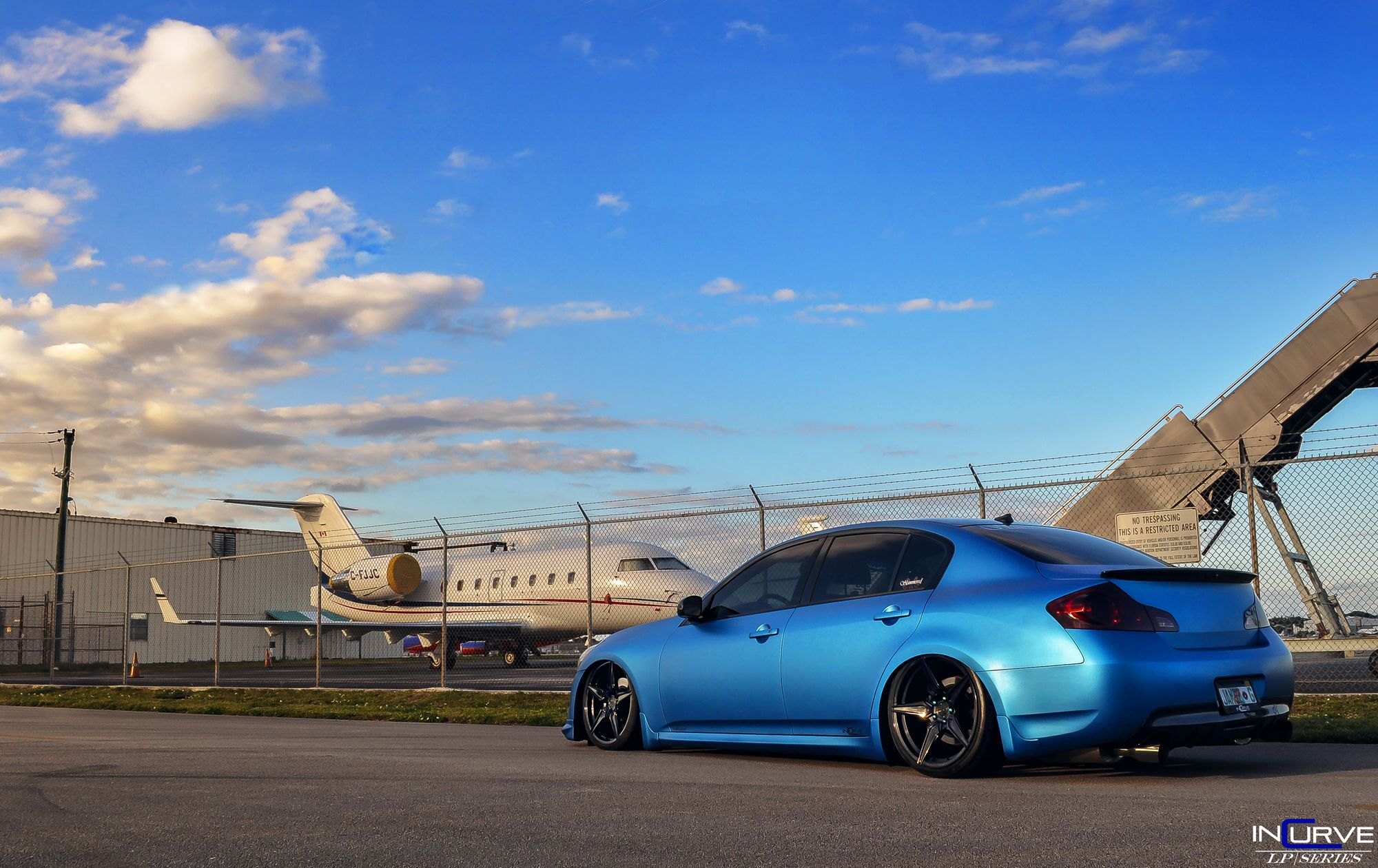 Blue Infiniti G35 with Rear Lip Spoiler - Photo by Incurve Wheels