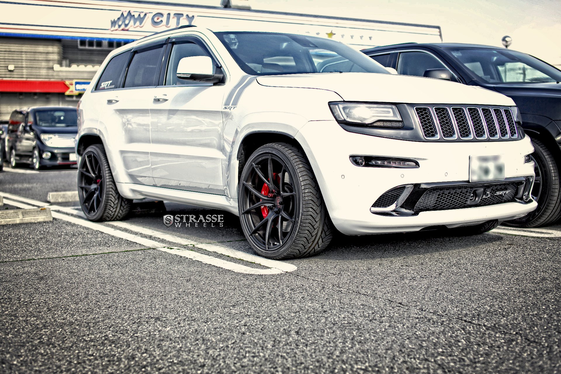 White Jeep Grand Cherokee with LED-Bar Style Headlights - Photo by Strasse Forged