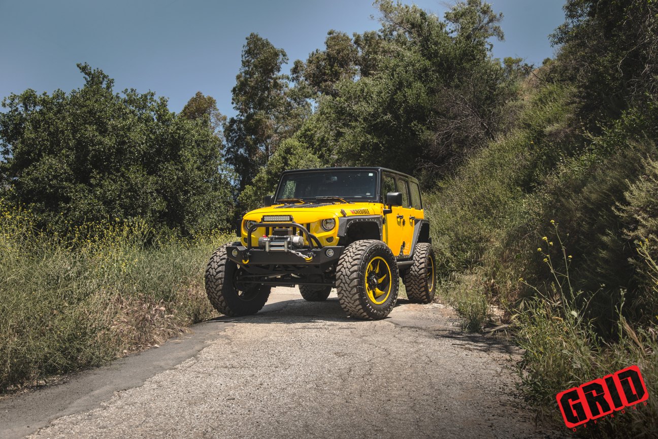 Yellow Lifted Jeep Wrangler with Custom Fender Flares - Photo by Grid Off-Road