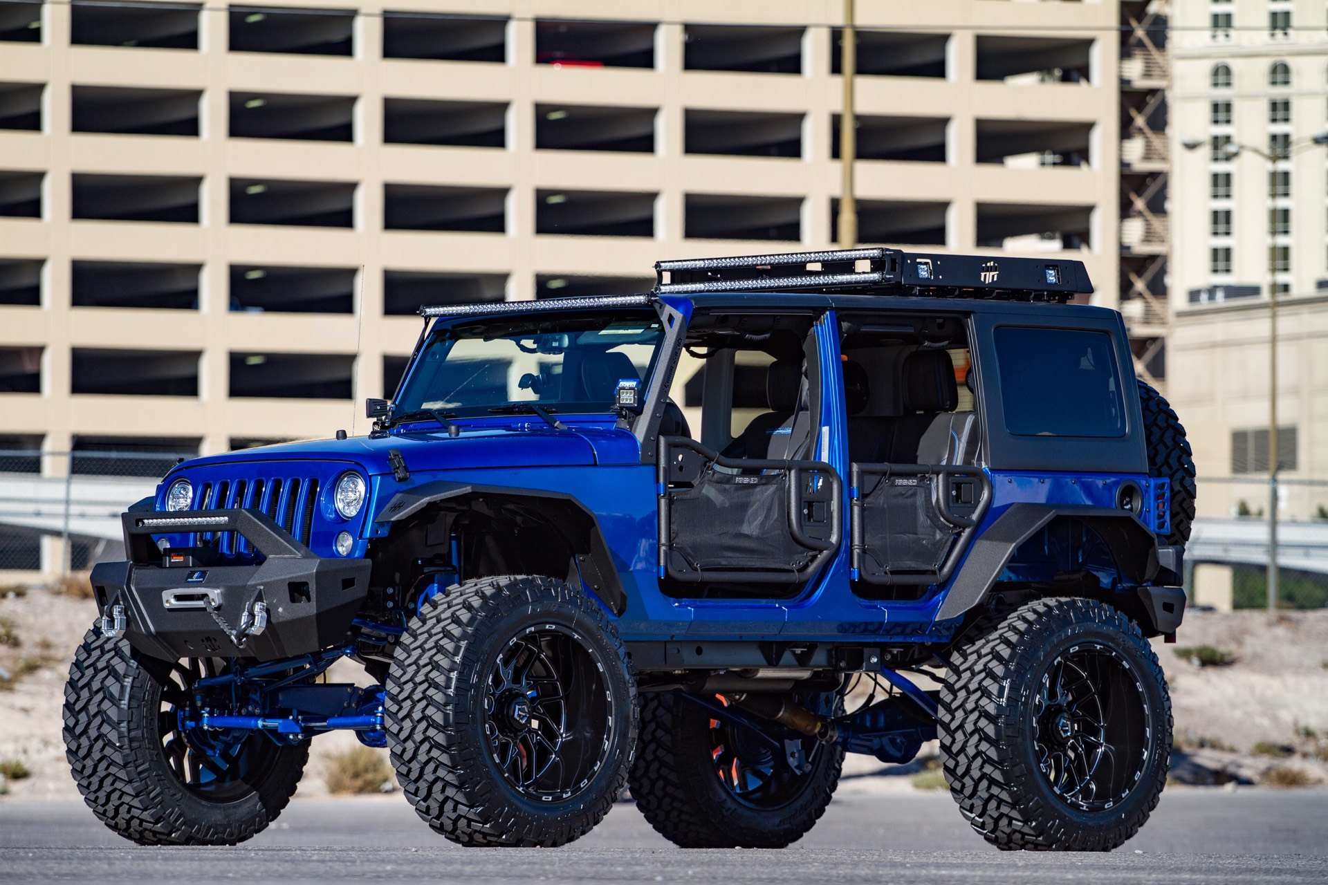 Blue Jeep Wrangler with Off-Road Front Bumper - Photo by TIS Wheels