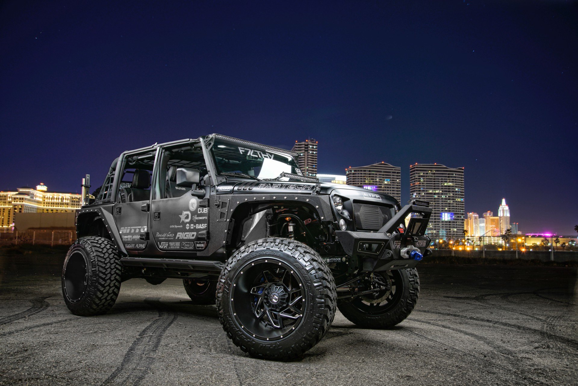 Custom Lifted Jeep Wrangler Unlimited with Nitto Tires - Photo by Dropstar