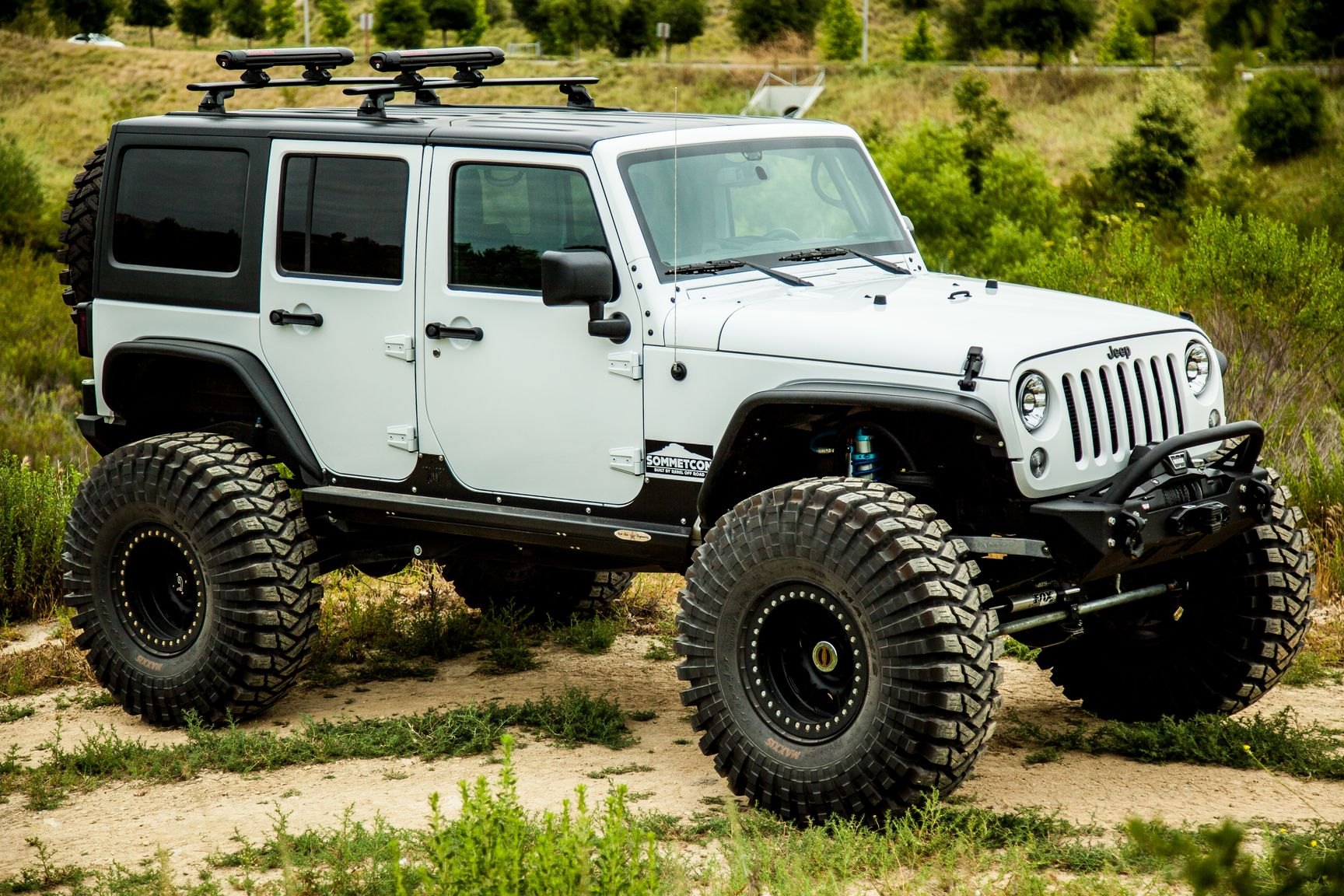 White Lifted Jeep Wrangler with Maxxis Tires - Photo by Rebel Off-Road