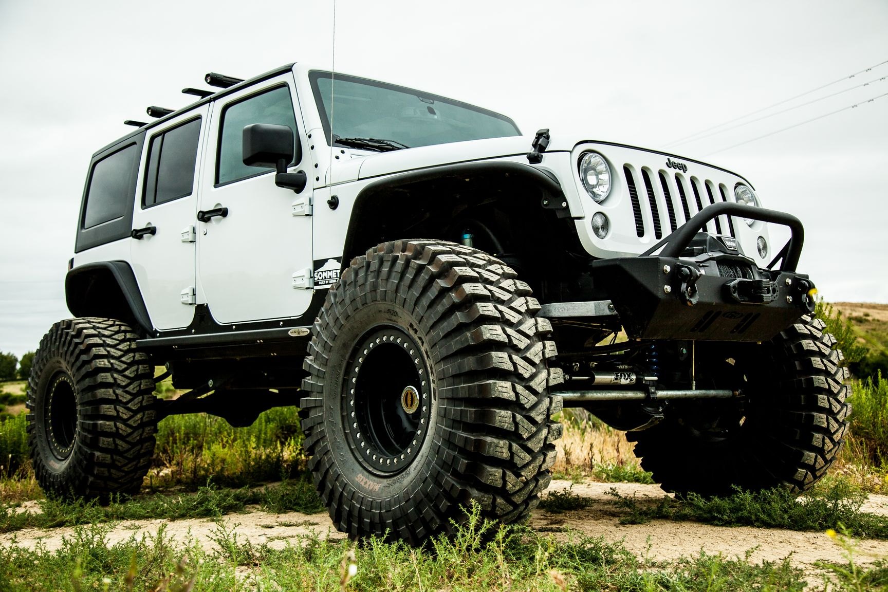 Custom Wheels on White Lifted Jeep Wrangler - Photo by Rebel Off-Road