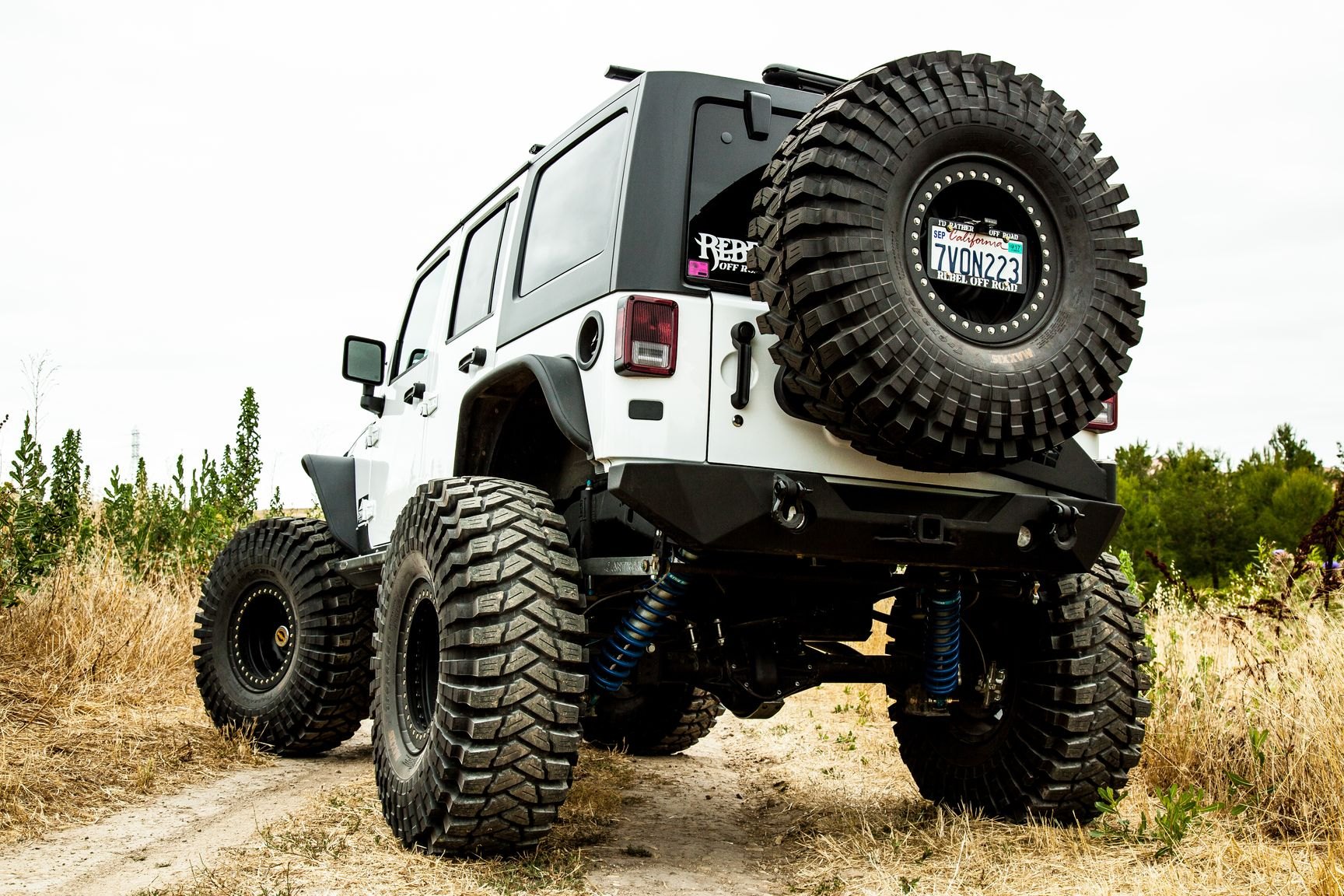 Off-Road Rear Bumper with Tow Hooks on White Jeep Wrangler - Photo by Rebel Off-Road