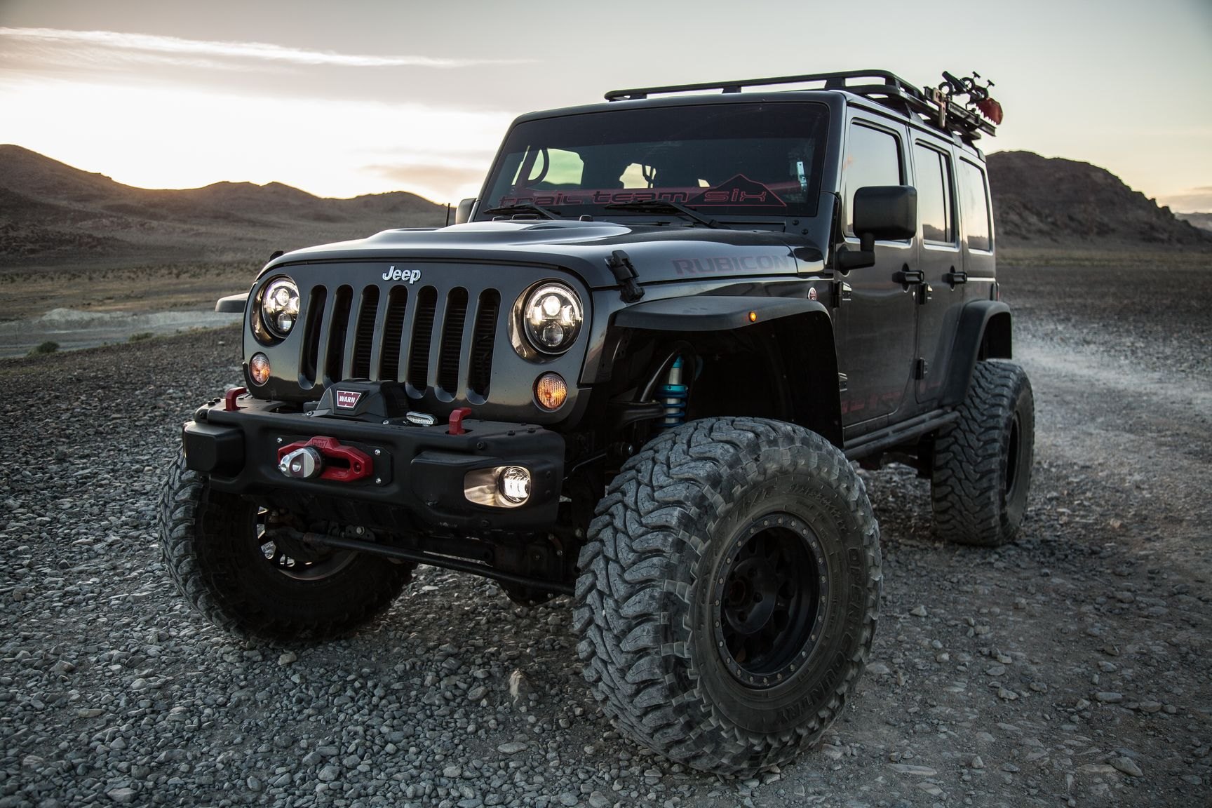 Black Lifted Jeep Wrangler with Warn Front Bumper - Photo by Rebel Off-Road