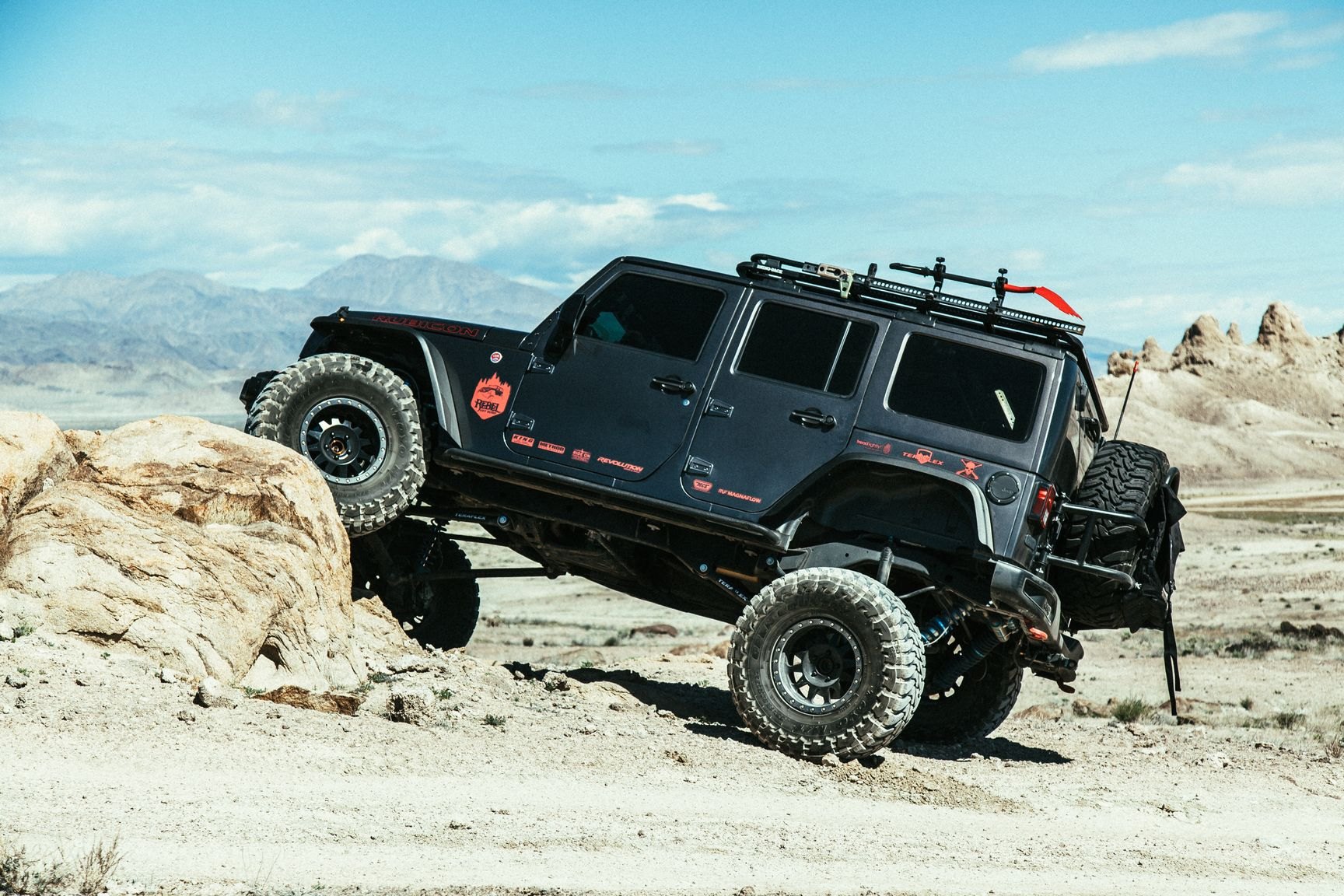 Custom Wheels on Black Lifted Jeep Wrangler Rubicon - Photo by Rebel Off-Road