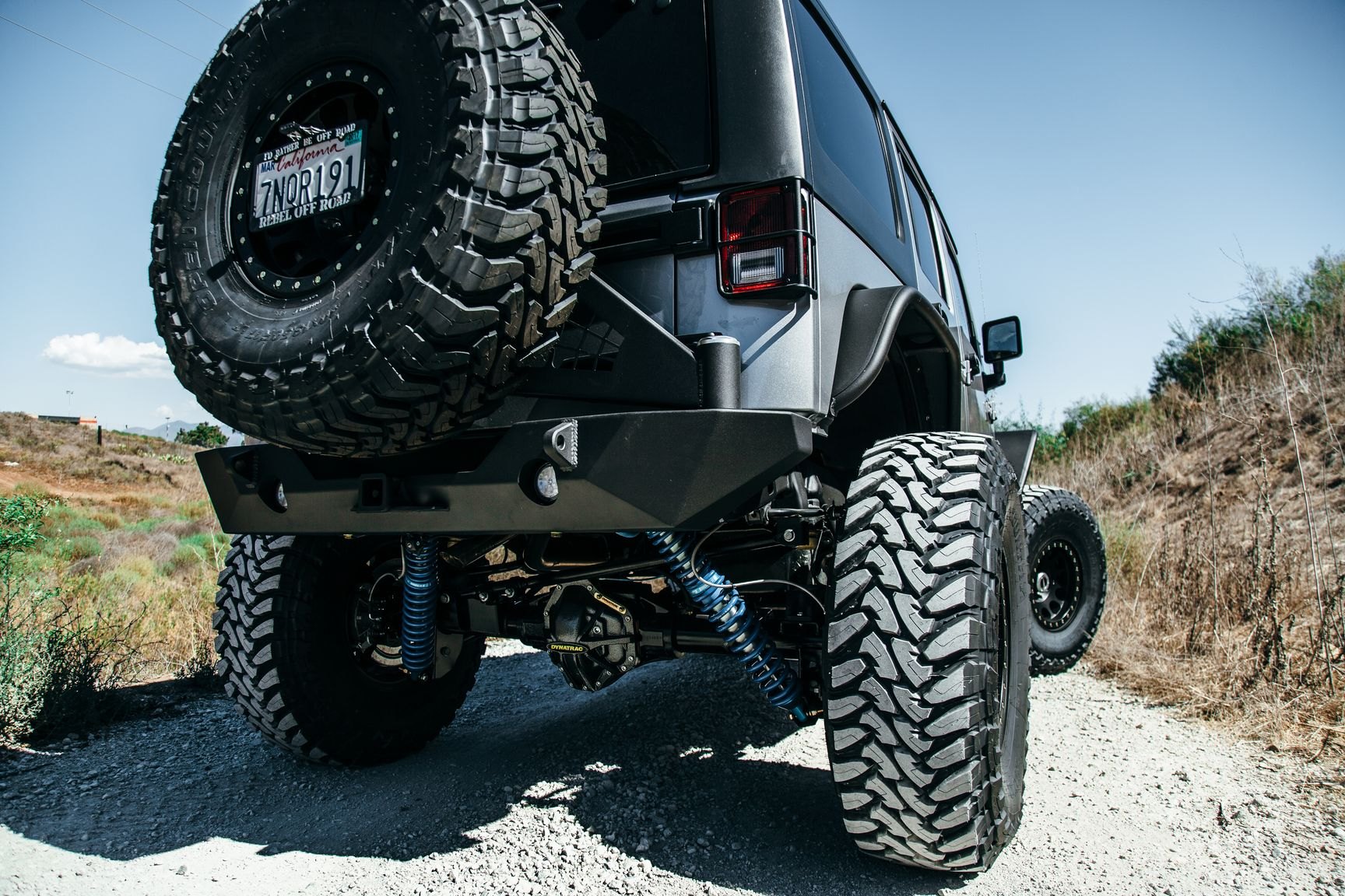 Gray Lifted Jeep Wrangler with Spare Tire Kit - Photo by Rebel Off-Road