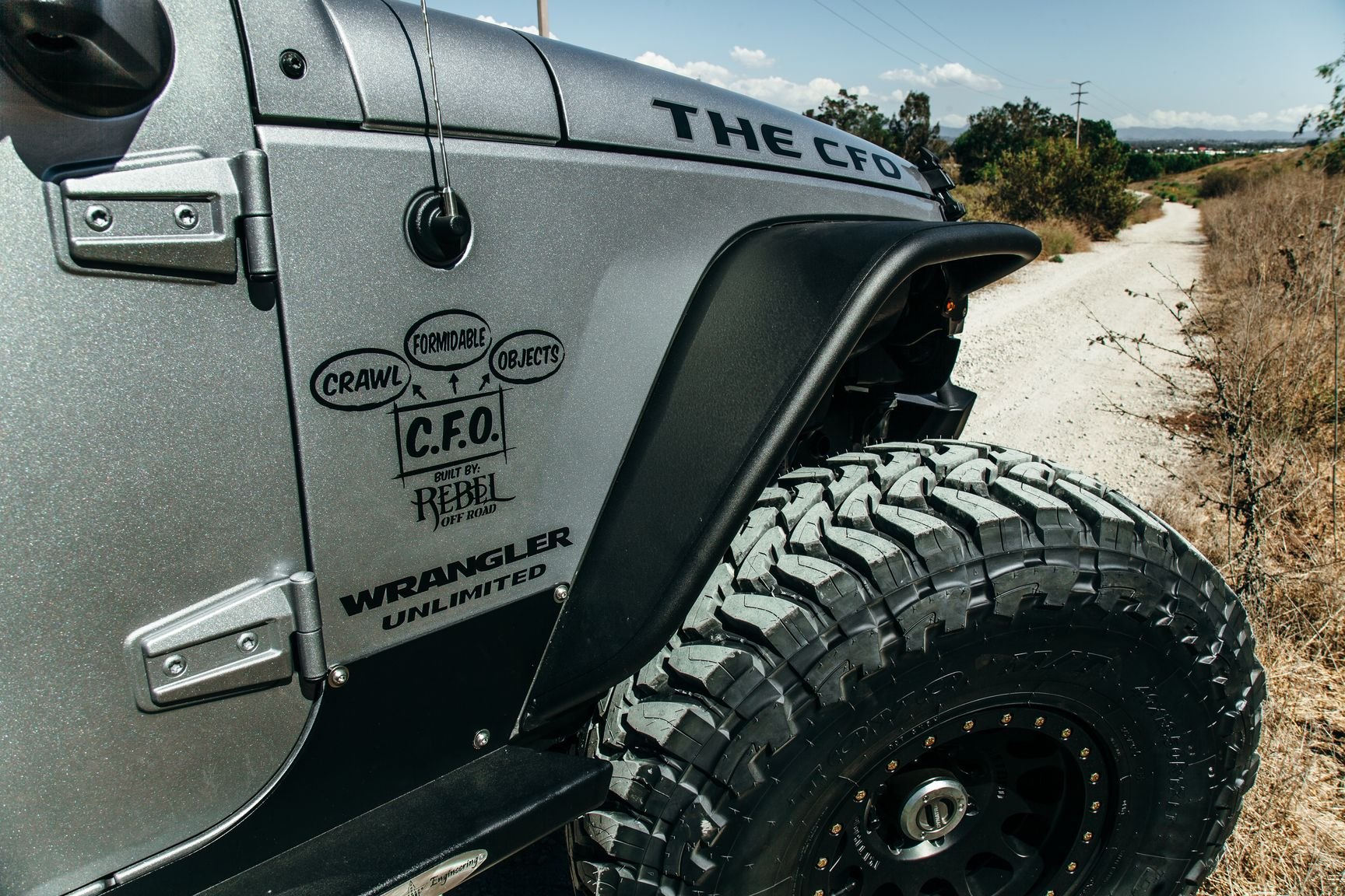 Gray Lifted Jeep Wrangler with Aftermarket Fender Flares - Photo by Rebel Off-Road