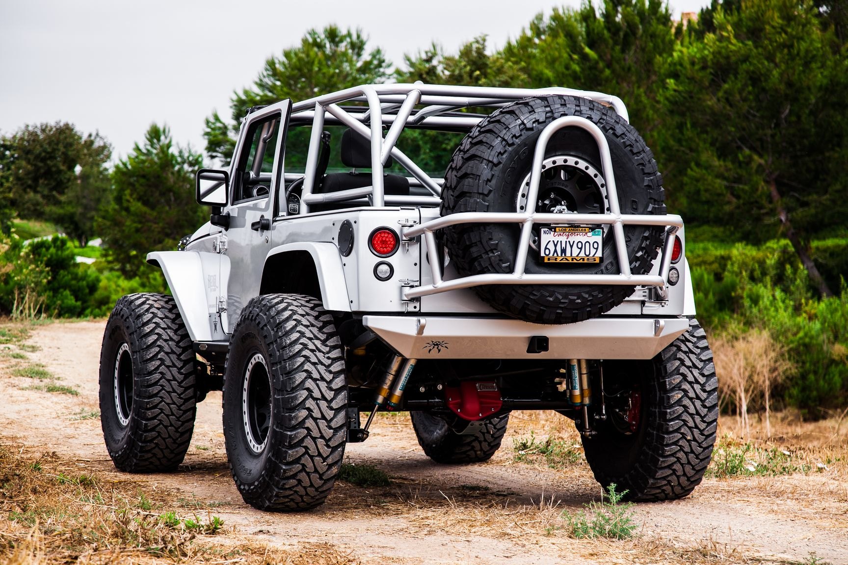 Toyo Spare Tire Kit on White Lifted Jeep Wrangler - Photo by Rebel Off-Road