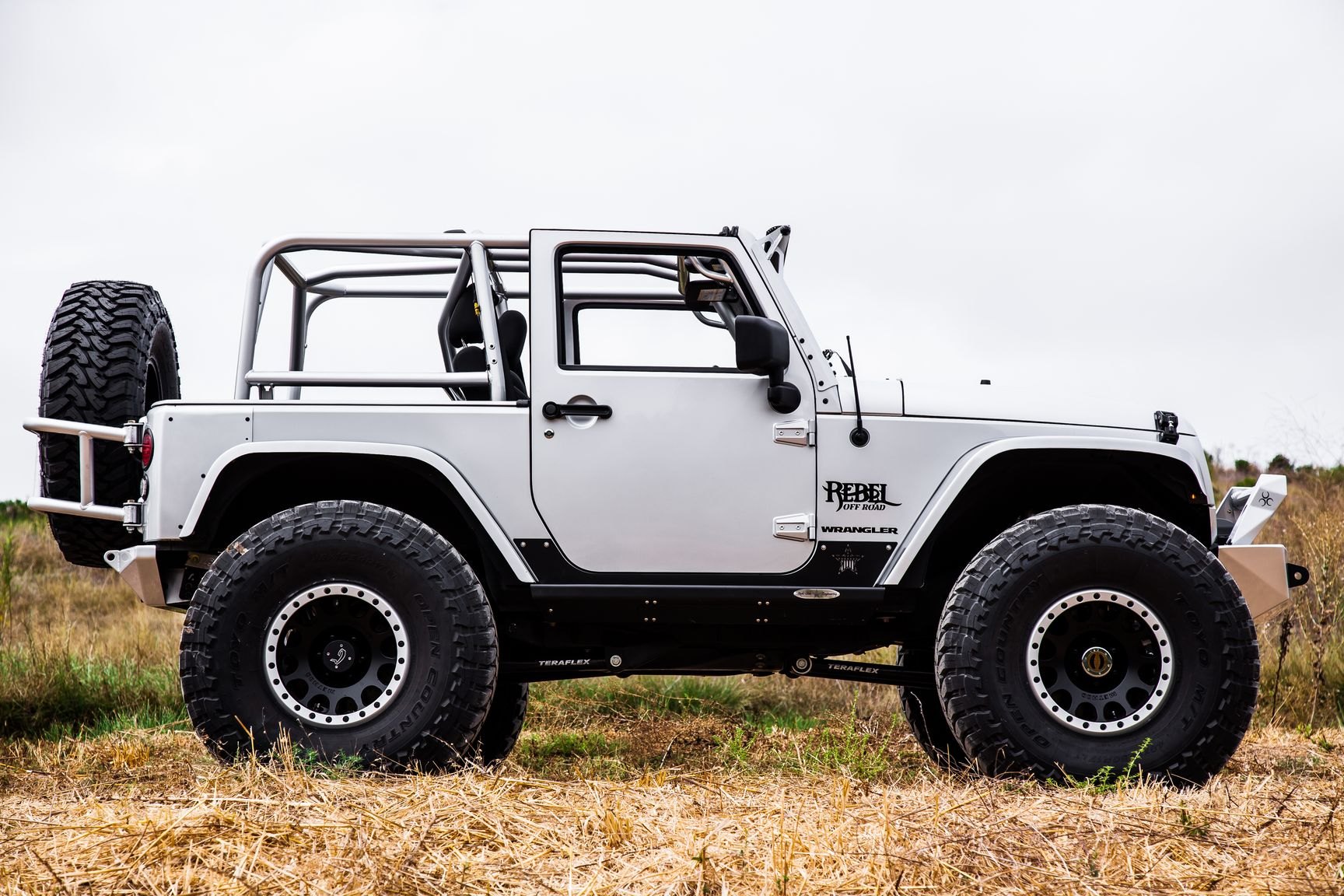 Custom Matte Black Wheels on White Lifted Jeep Wrangler - Photo by Rebel Off-Road