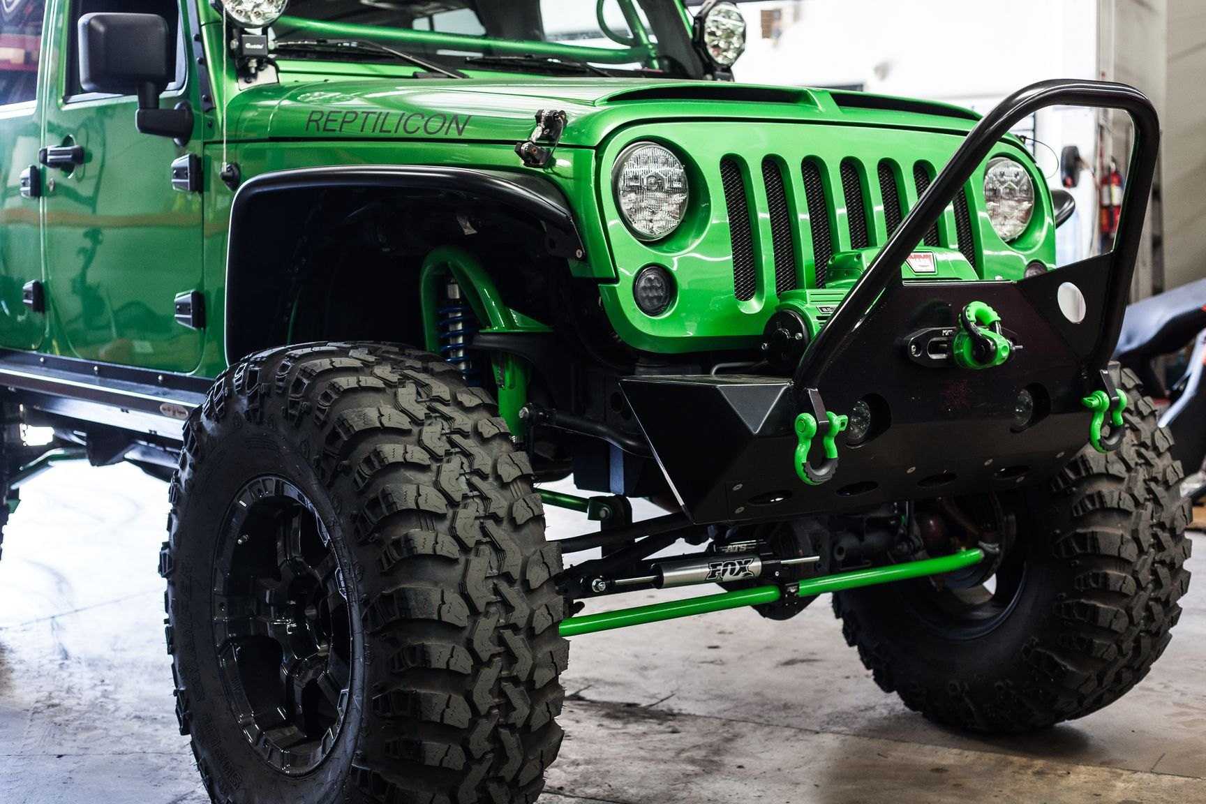 Aftermarket Off-Road Front Bumper on Green Lifted Jeep Wrangler - Photo by Rebel Off-Road