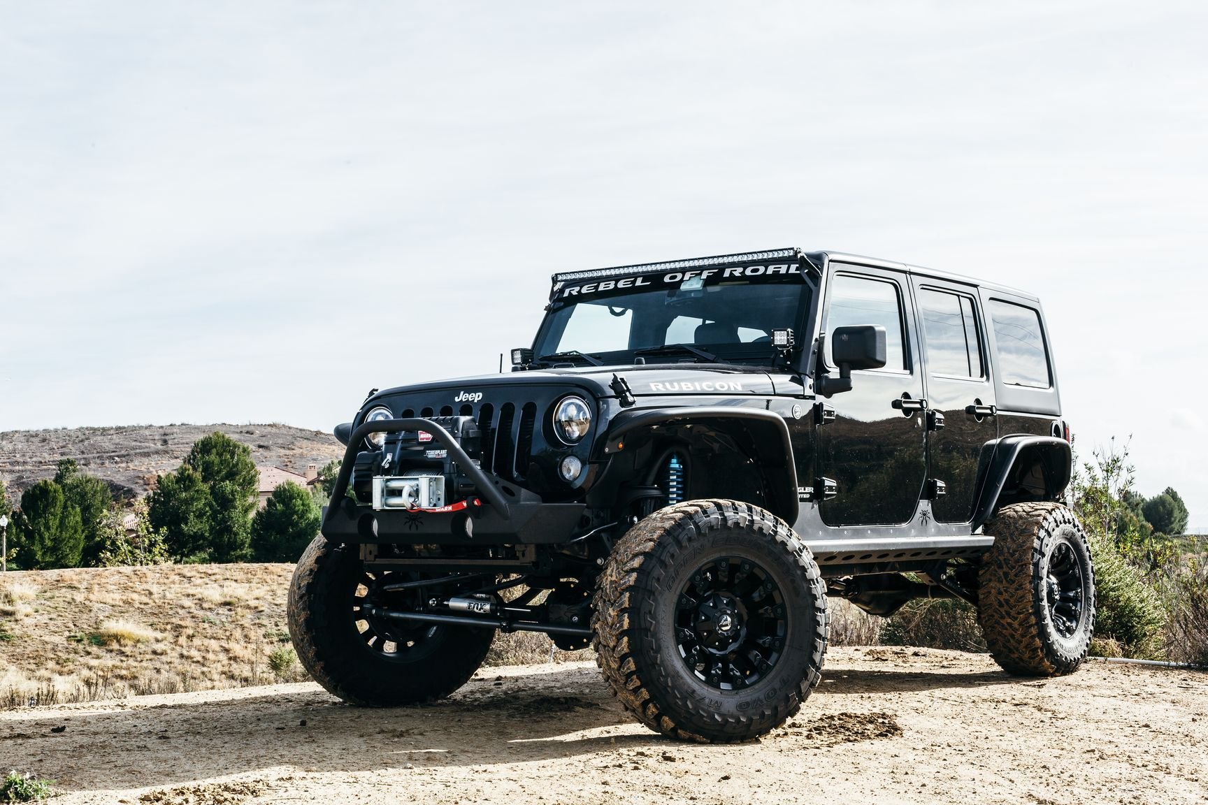 Toyo Open Country Tires on Custom Black Jeep Wrangler Rubicon - Photo by Rebel Off-Road