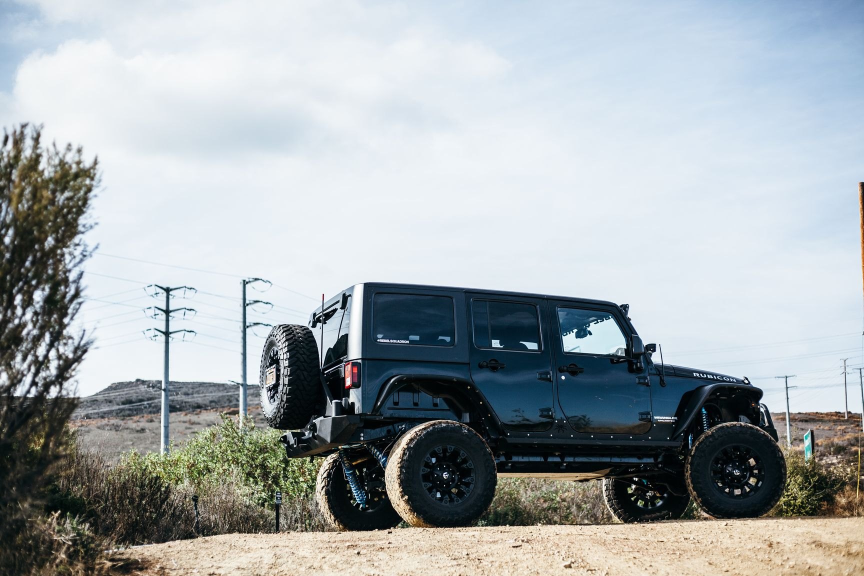 Black Lifted Jeep Wrangler with Custom Fender Flares - Photo by Rebel Off-Road