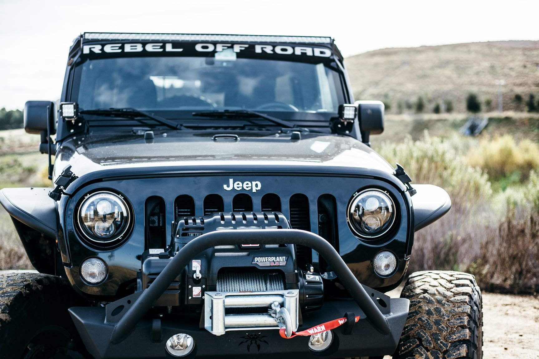 Black Lifted Jeep Wrangler with Poison Spyder Front Bumper - Photo by Rebel Off-Road