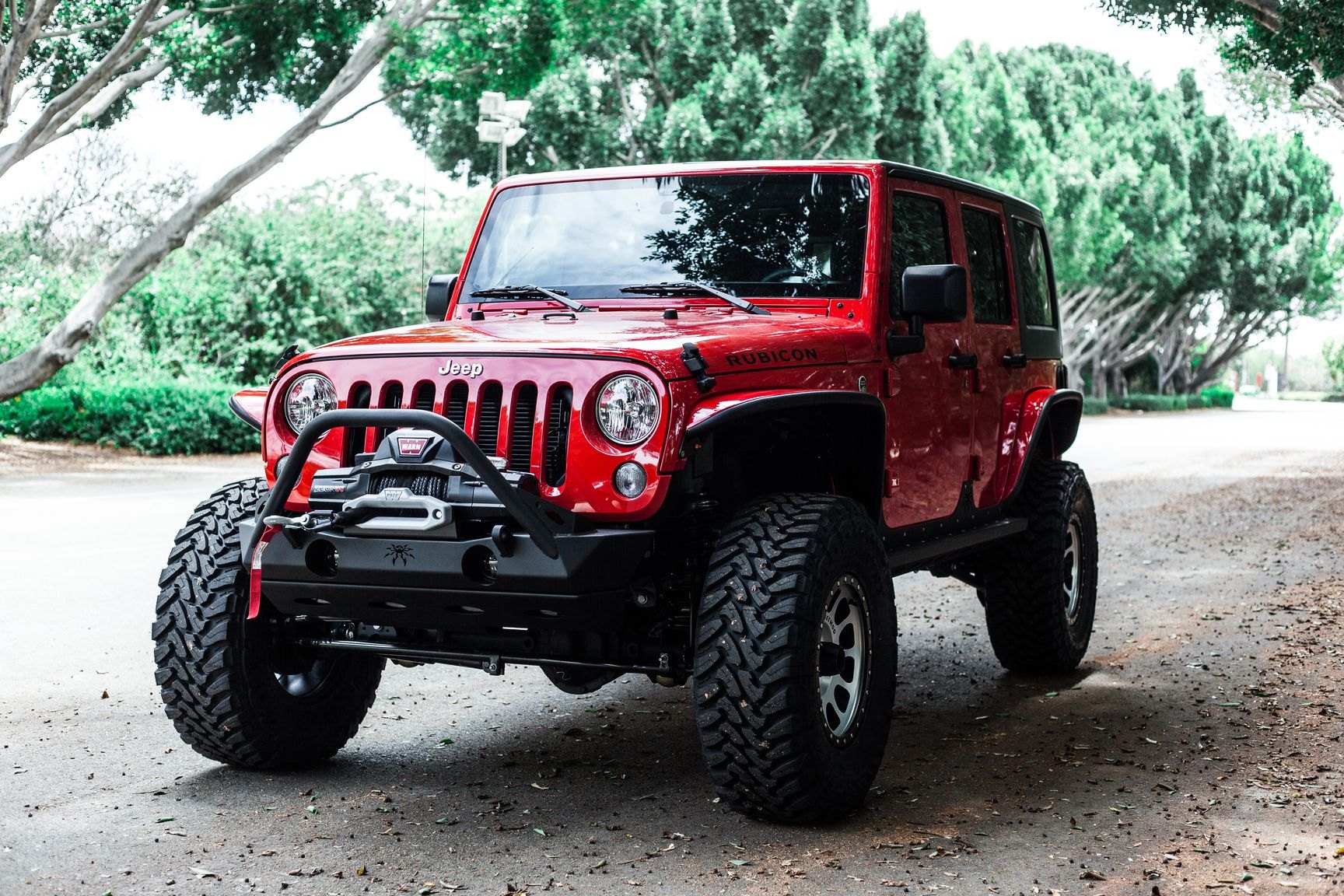 Poison Spyder Front Bumper on Red Jeep Wrangler Rubicon - Photo by Rebel Off-Road