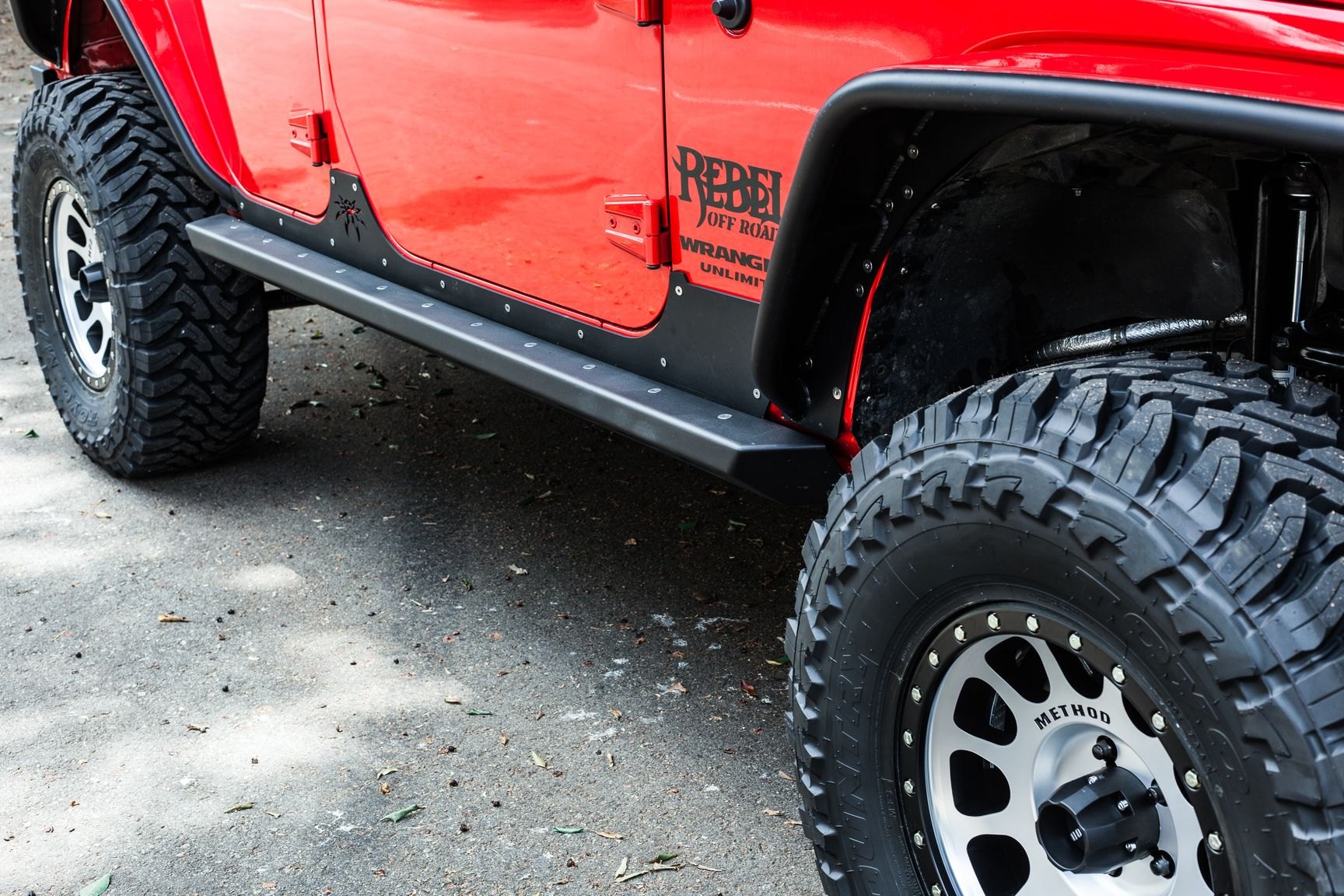 Red Jeep Wrangler Rubicon on Toyo Tires - Photo by Rebel Off-Road