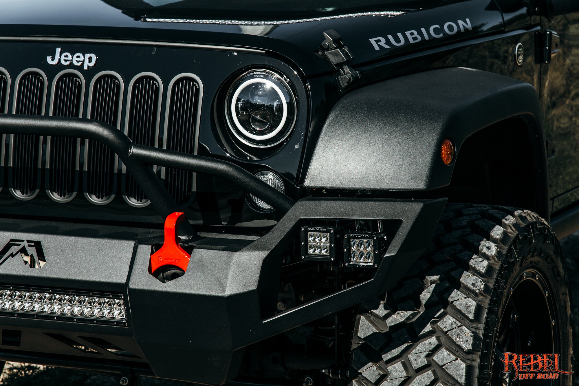 Black Lifted Jeep Wrangler with Dark Smoke LED Headlights - Photo by Rebel Off-Road