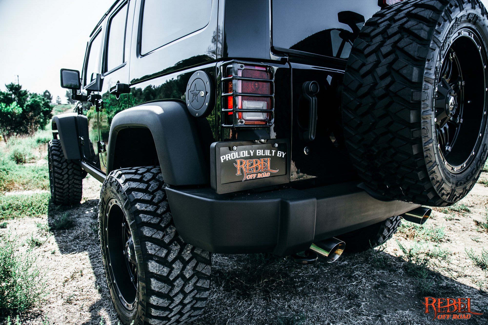 Black Lifted Jeep Wrangler with Custom Red Taillights - Photo by Rebel Off-Road