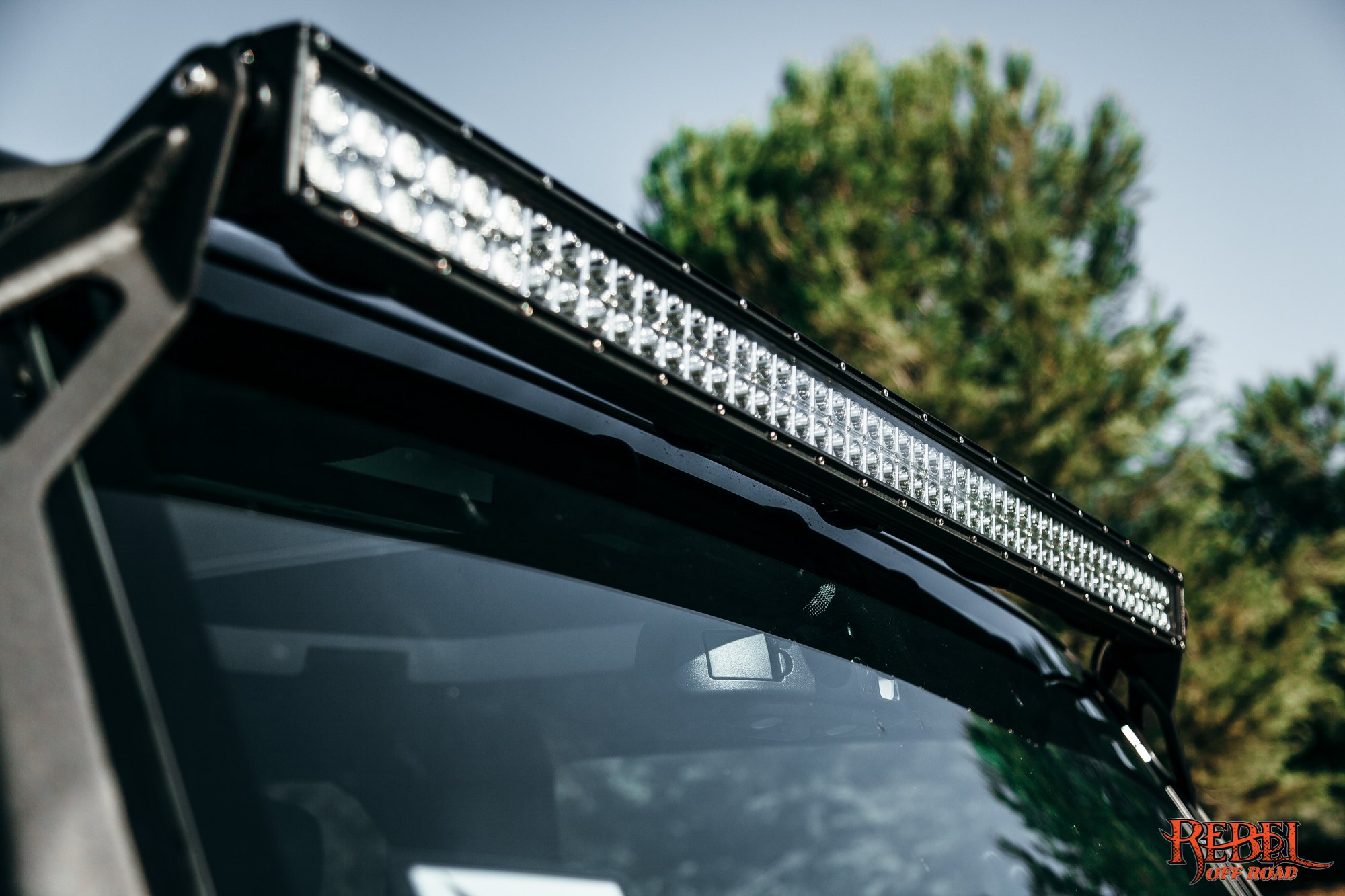 Roof Mount LED Light Bar on Black Jeep Wrangler - Photo by Rebel Off-Road