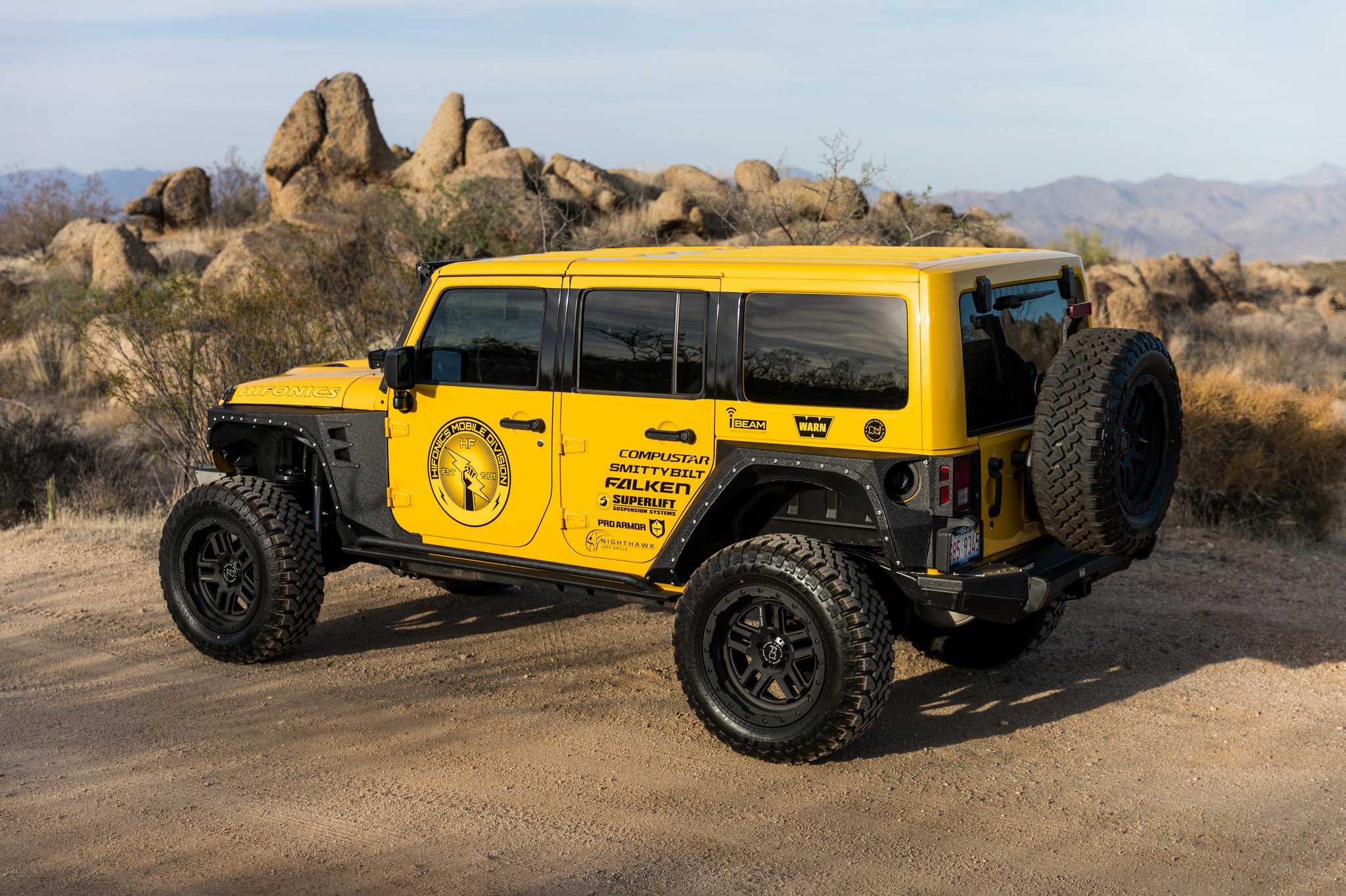 Yellow Lifted Jeep Wrangler with Aftermarket Fender Flares - Photo by Black Rhino Wheels