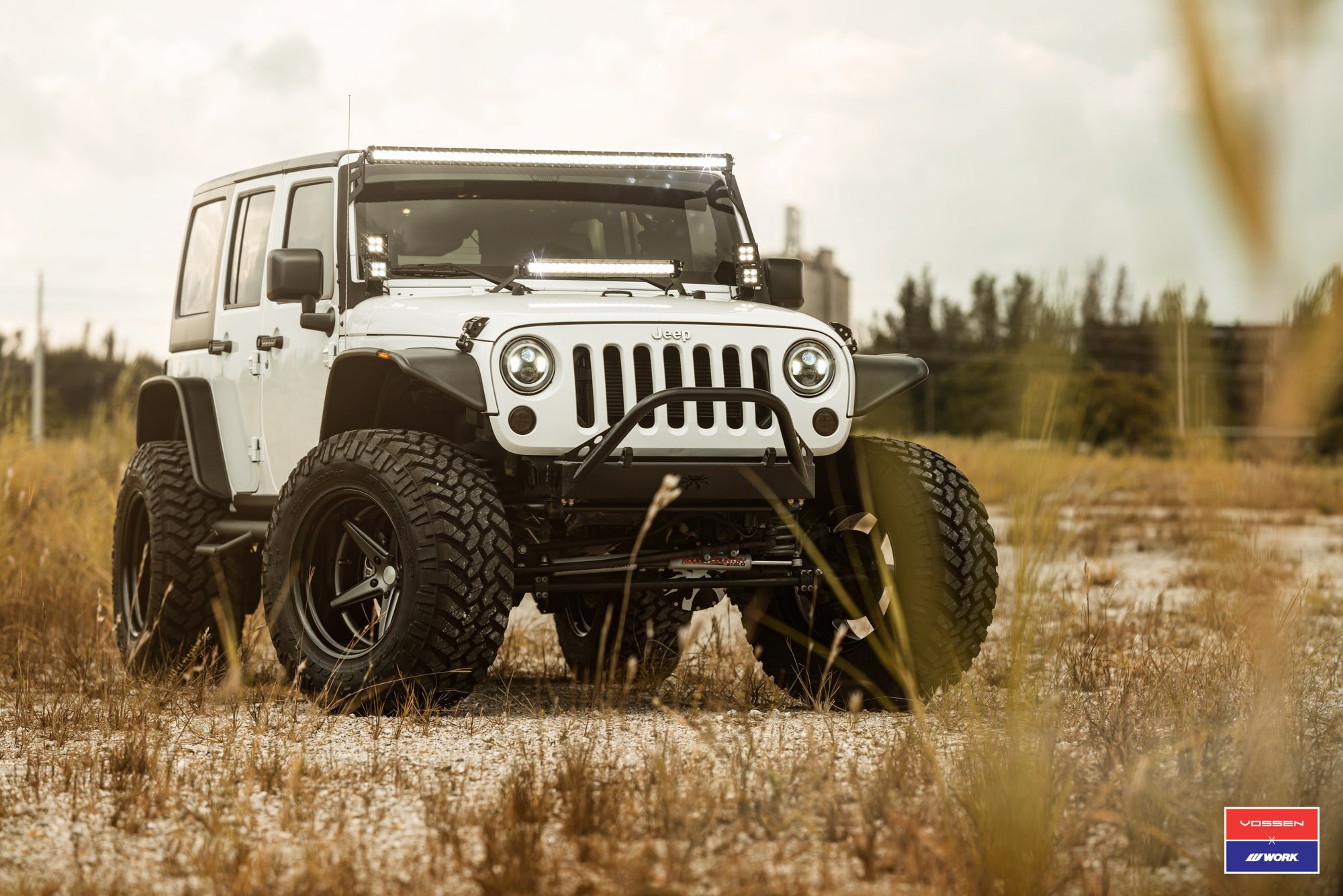 Super Clean JK with Cut-out Aluminum Fenders and Stinger Bumper on 37s - Photo by Vossen