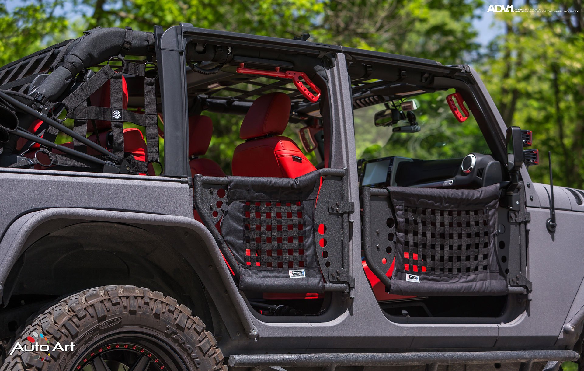 Gray Jeep Wrangler with Custom Red Seats - Photo by ADV.1