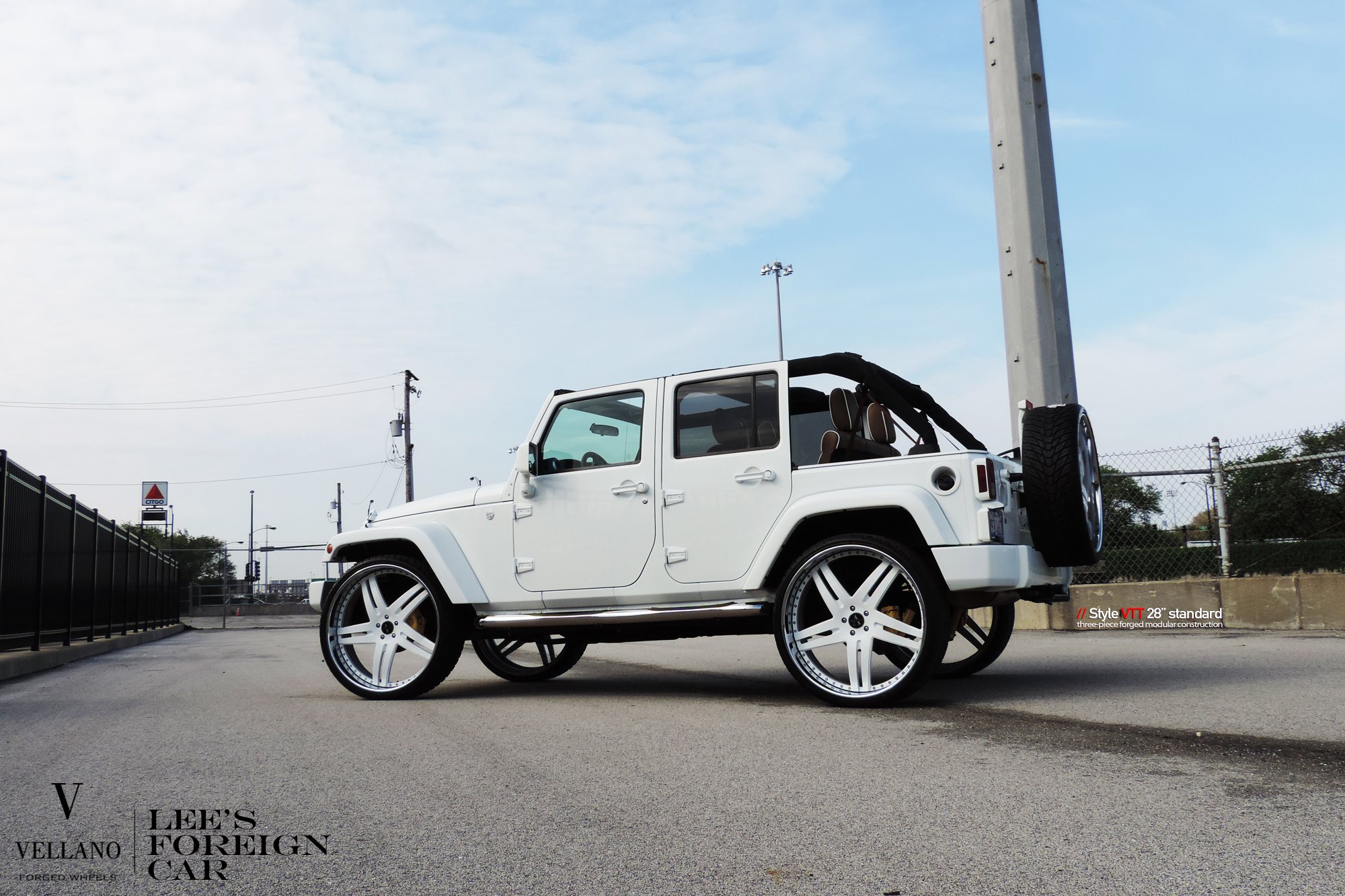 White Jeep Wrangler with Spare Tire Kit - Photo by Vellano