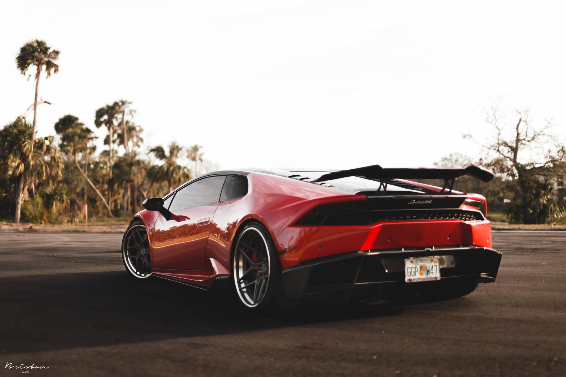 Carbon Fiber Rear Diffuser on Red Lamborghini Huracan - Photo by Brixton Forged Wheels